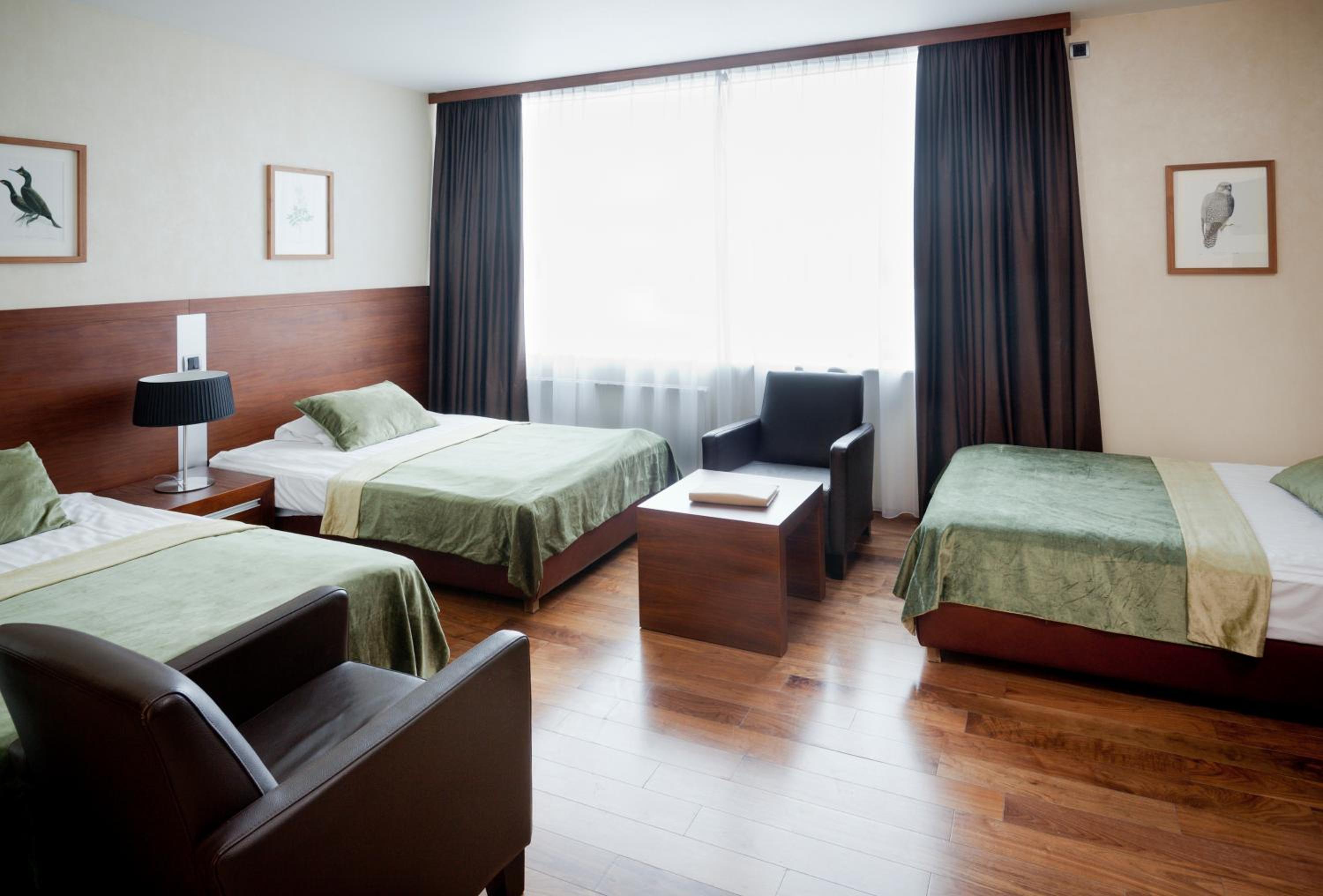 Relax in comfort with stylish bedding and serene decor.