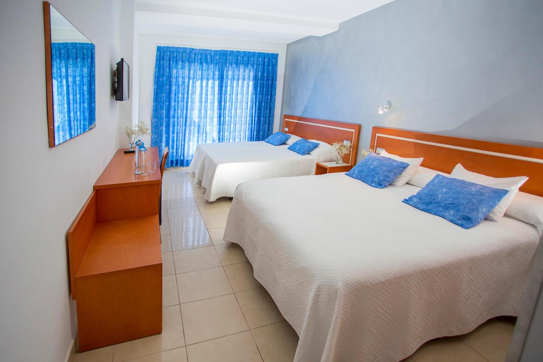 Habitación Cuádruple (2 Adultos + 2 Niños)