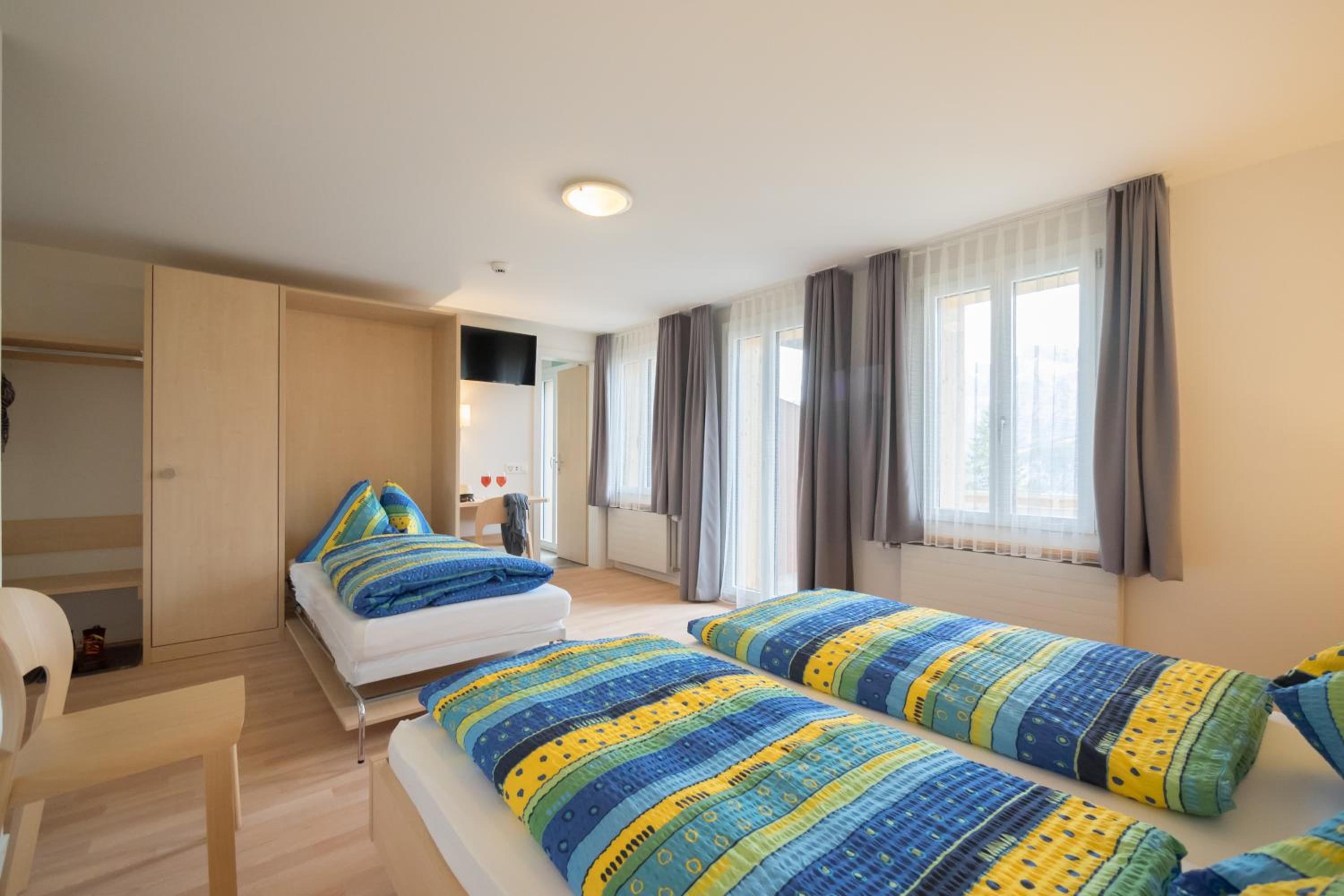 Deluxe Triple Room with Balcony and Mountain View photo 1