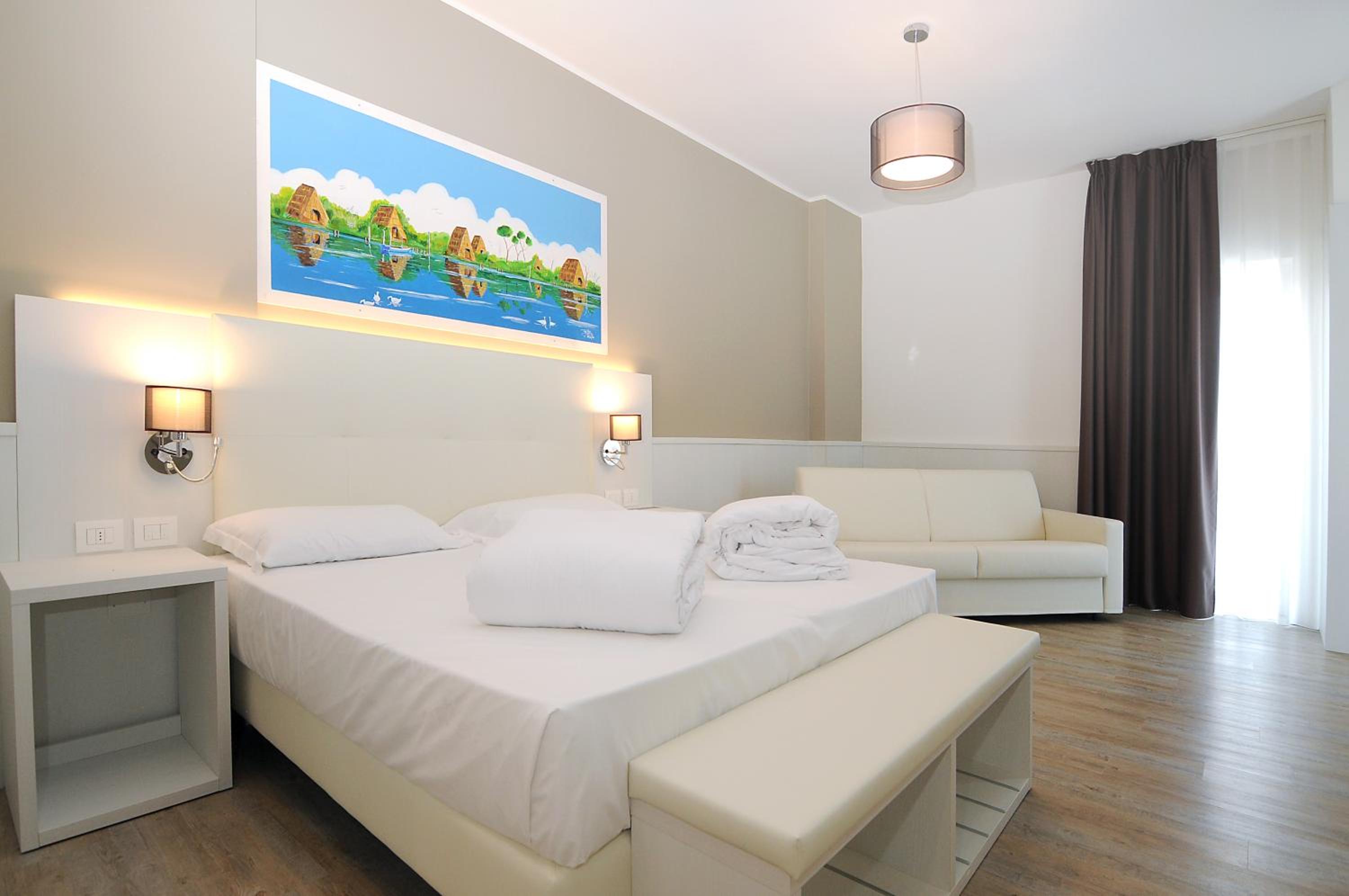 Deluxe Quadruple Room with Side Sea View - Photo 1