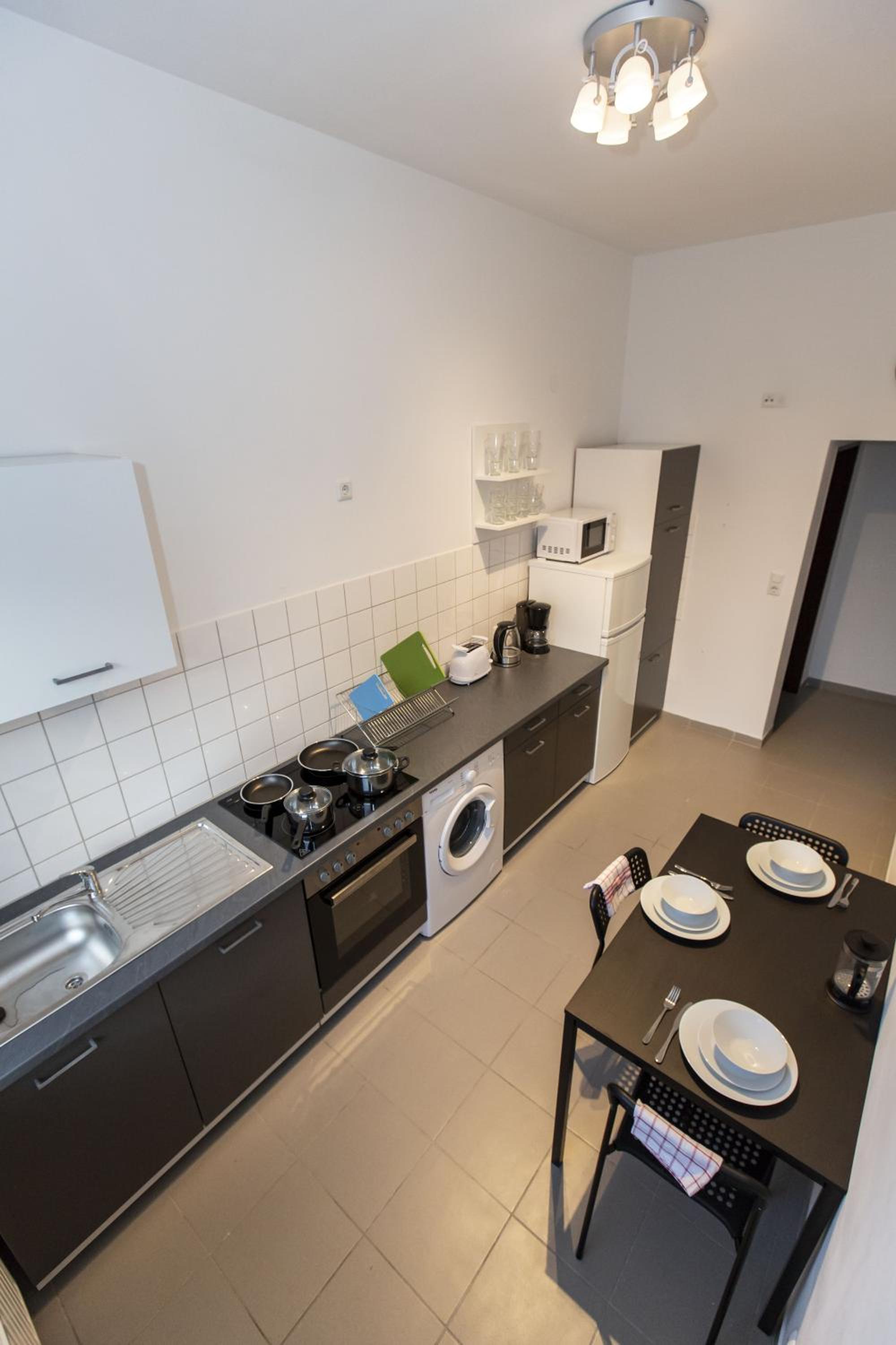 Three-Bedroom Apartment - Photo 10