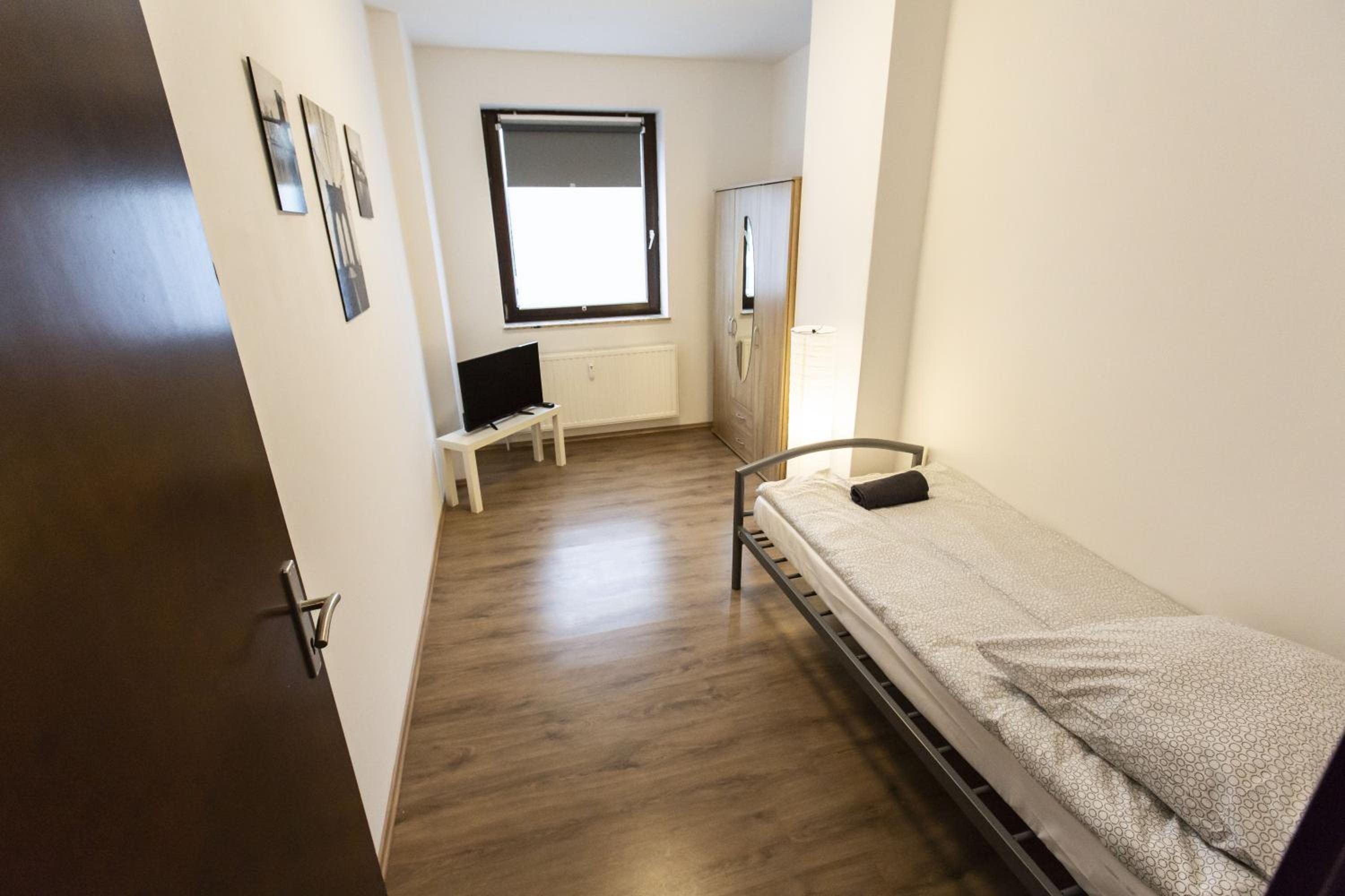 Three-Bedroom Apartment - Photo 16