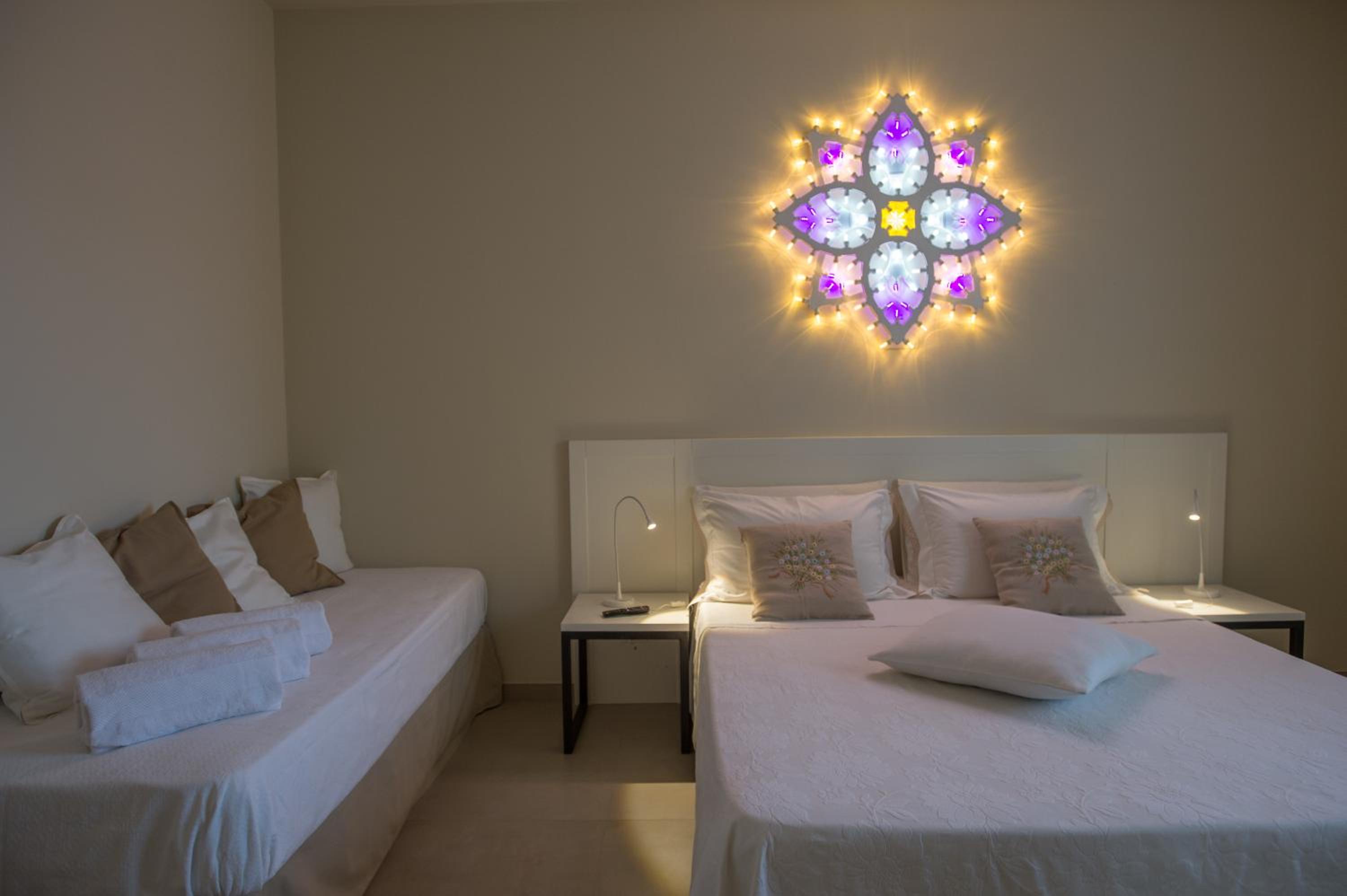 Quadruple Room with Balcony - Photo 1