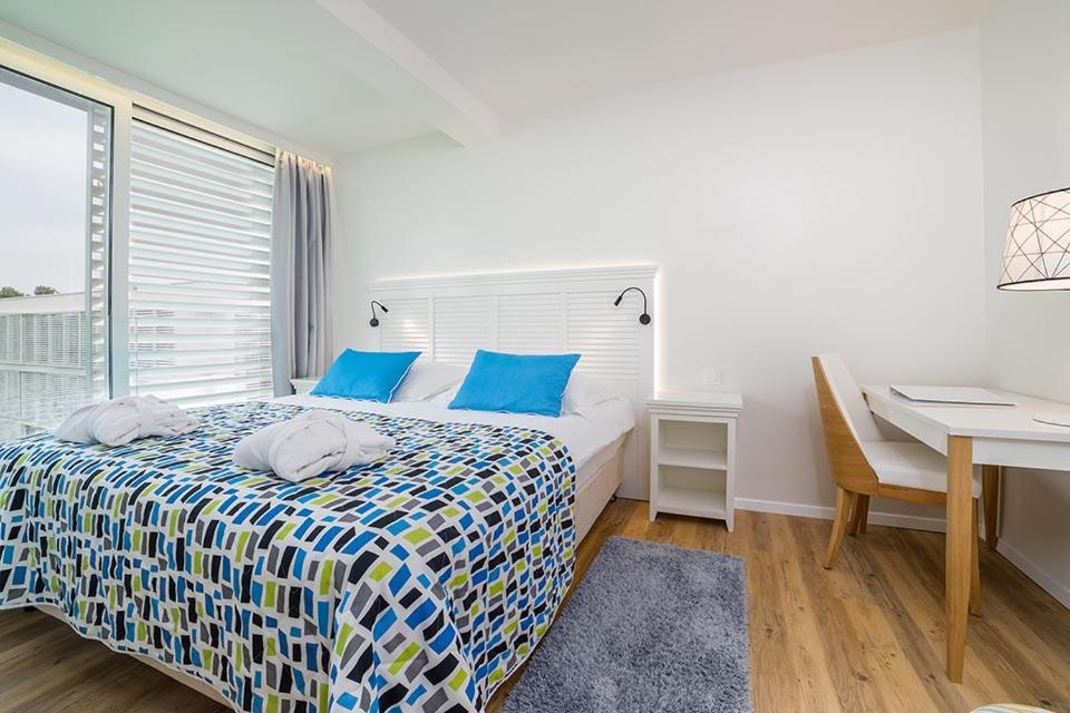 Suite with Balcony and Courtyard View