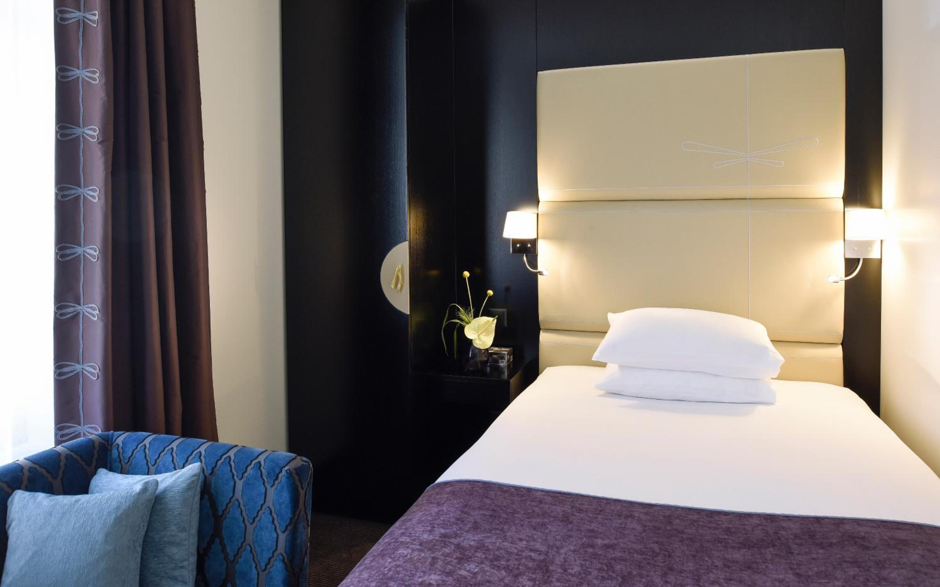 Relax in style with our cozy hotel rooms!