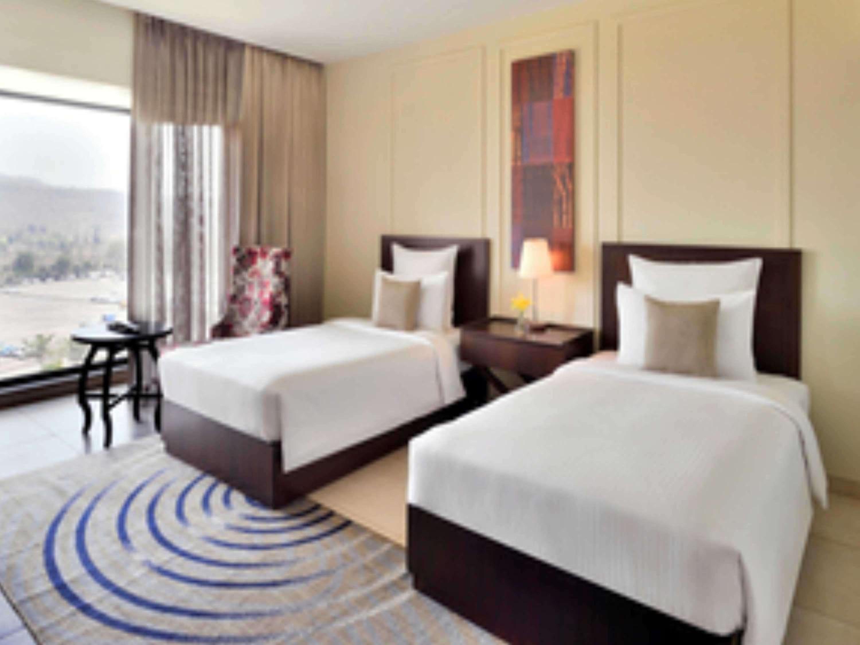 Deluxe Twin Room with Balcony with Complimentary one free ticket for Trampoline Park at Imagicaa per room per stay and 20% discount on Food and Beverage - Photo 4