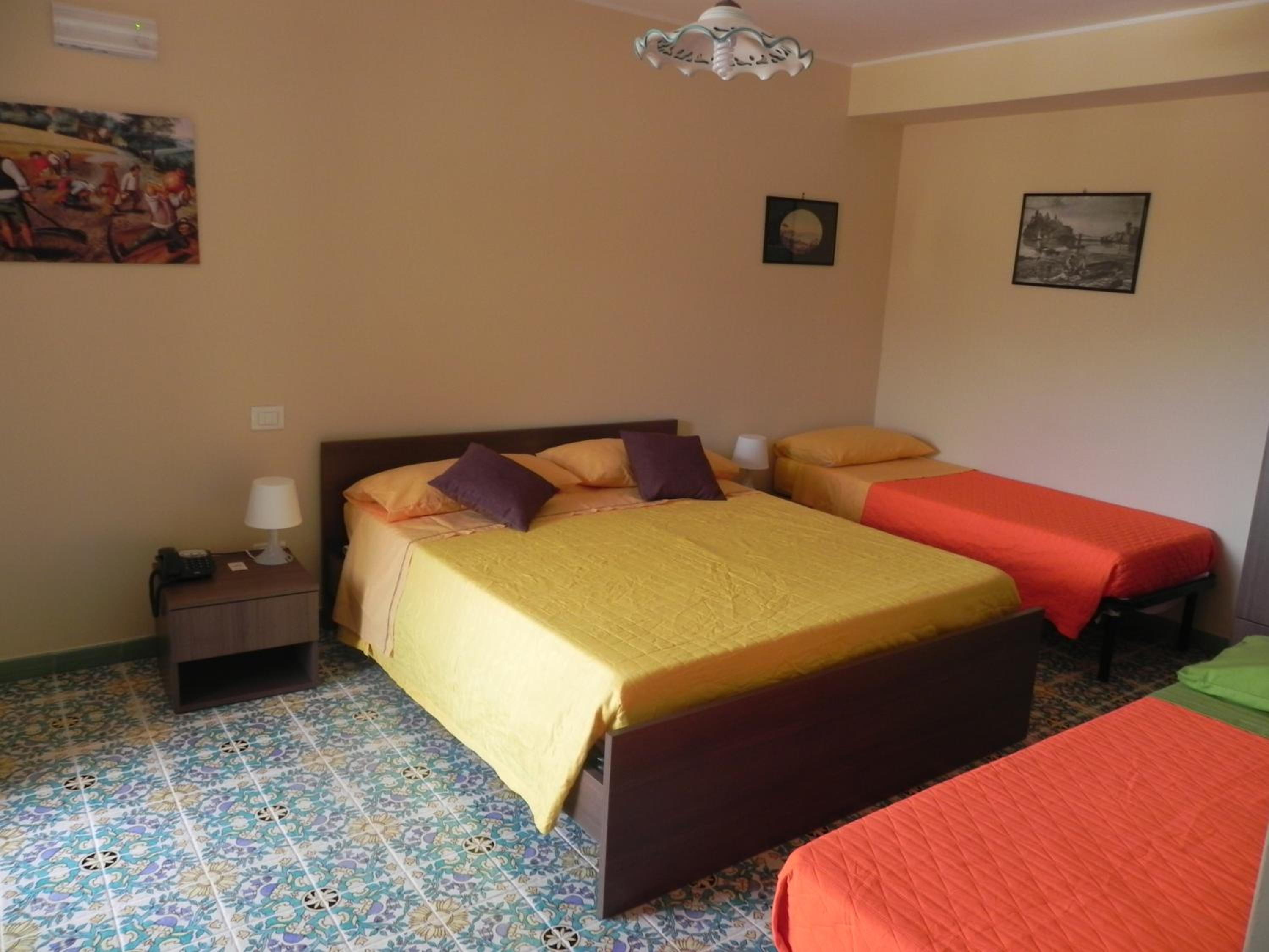 Quadruple Deluxe Room (2 Adults + 2 Child)