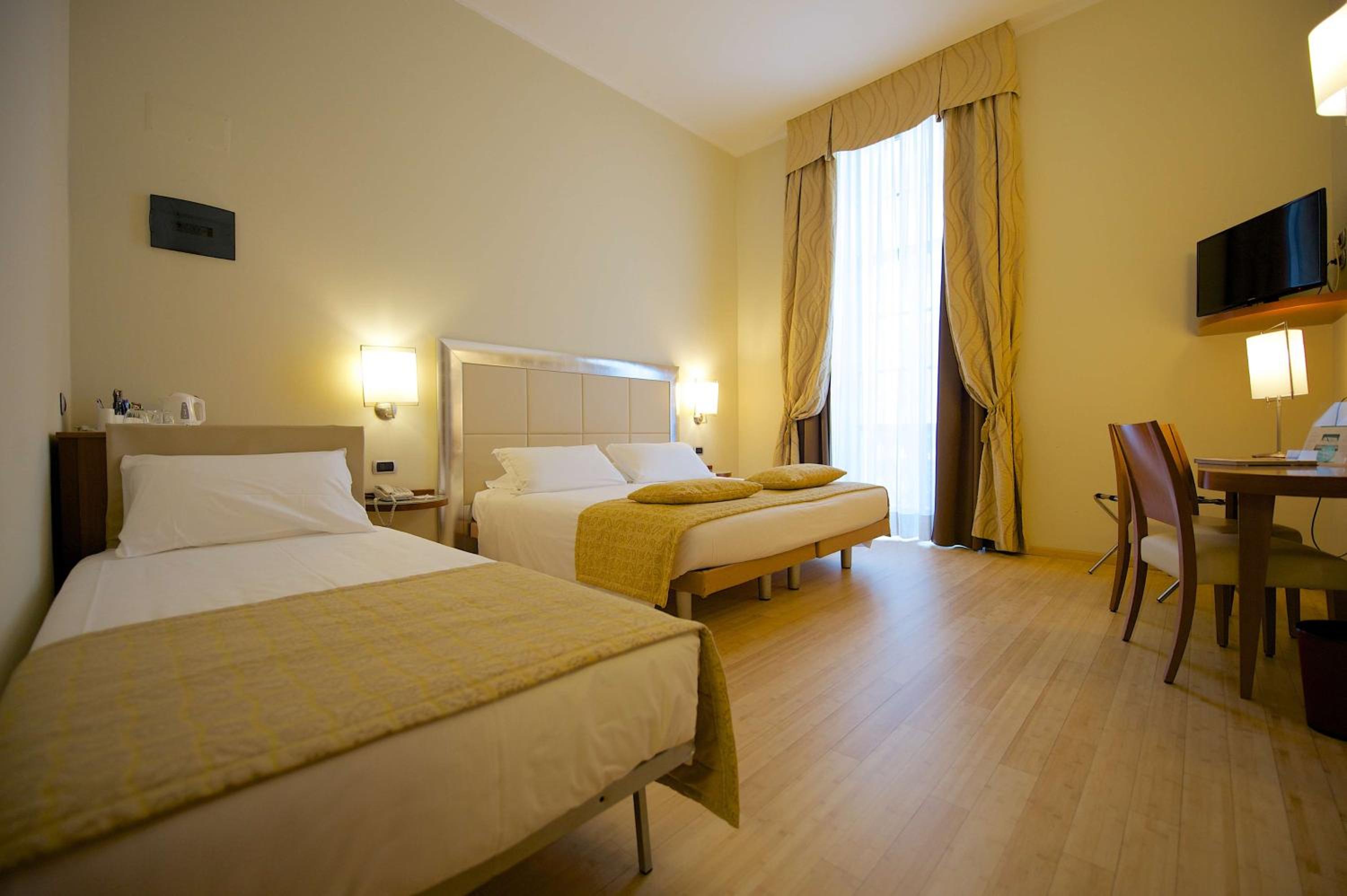 Standard Triple Room with Queen Bed and Single Bed - Photo 1