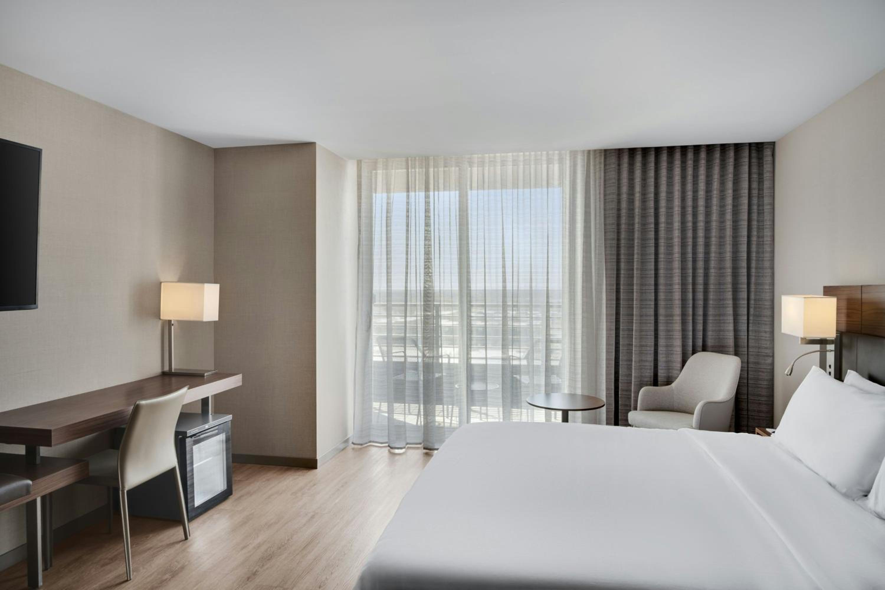 King Room with Balcony and Roll-In Shower - Mobility Access