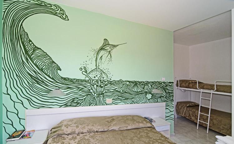 Quadruple Room with Balcony and Partial Sea View - Photo 1