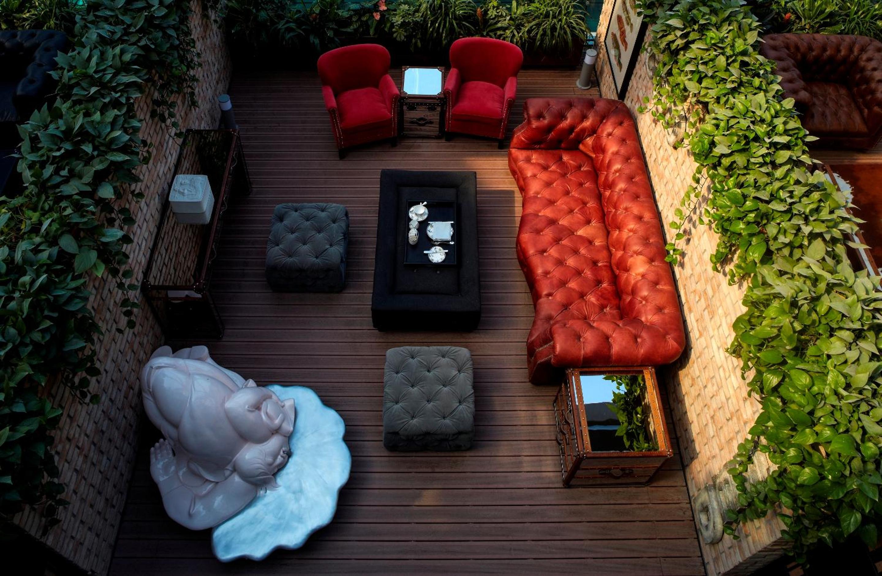view of an outdoor living area with red couches