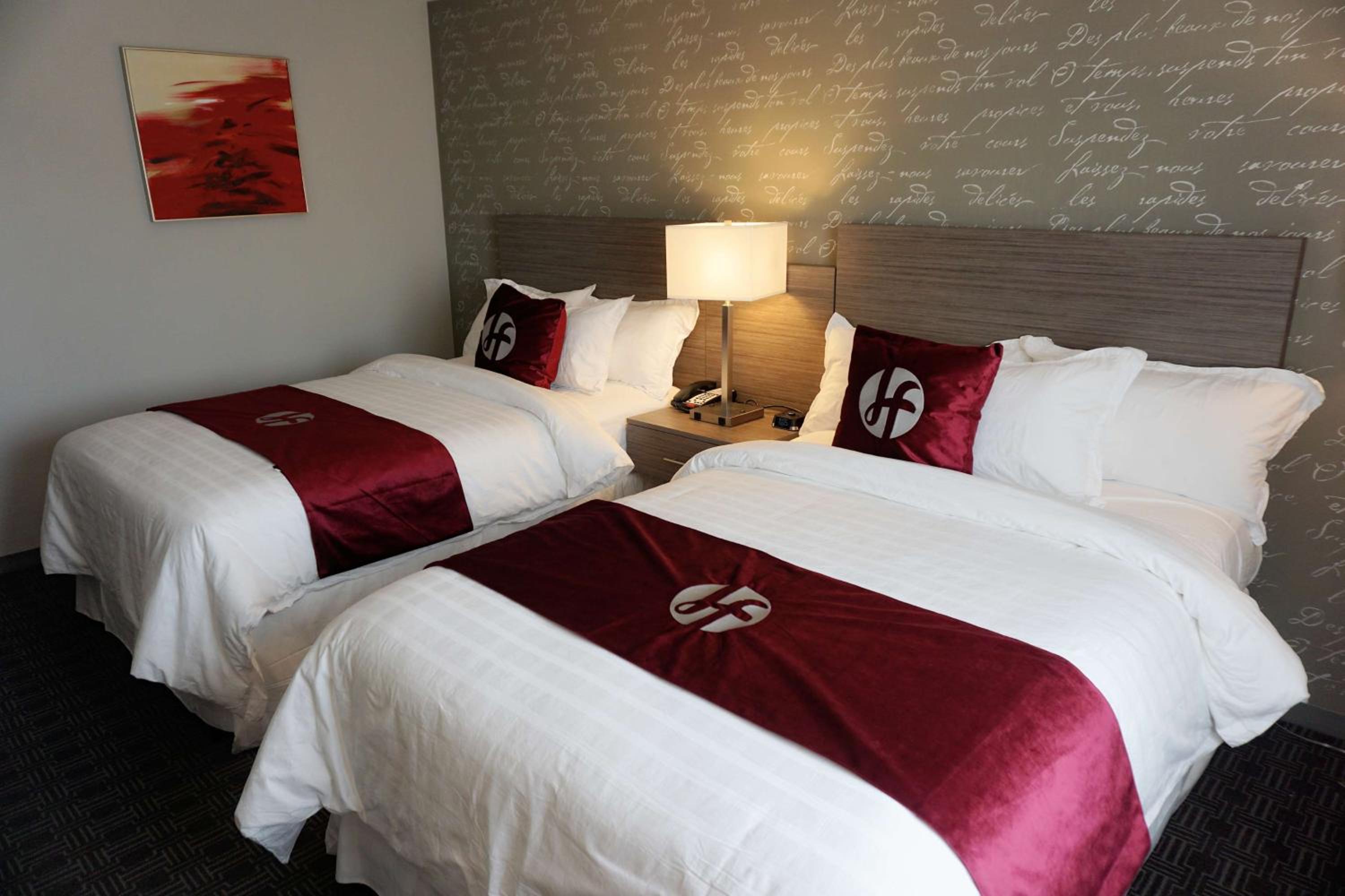 Two-Bedroom Suite with One King Bed and Two Double Beds - Non-Smoking photo 2