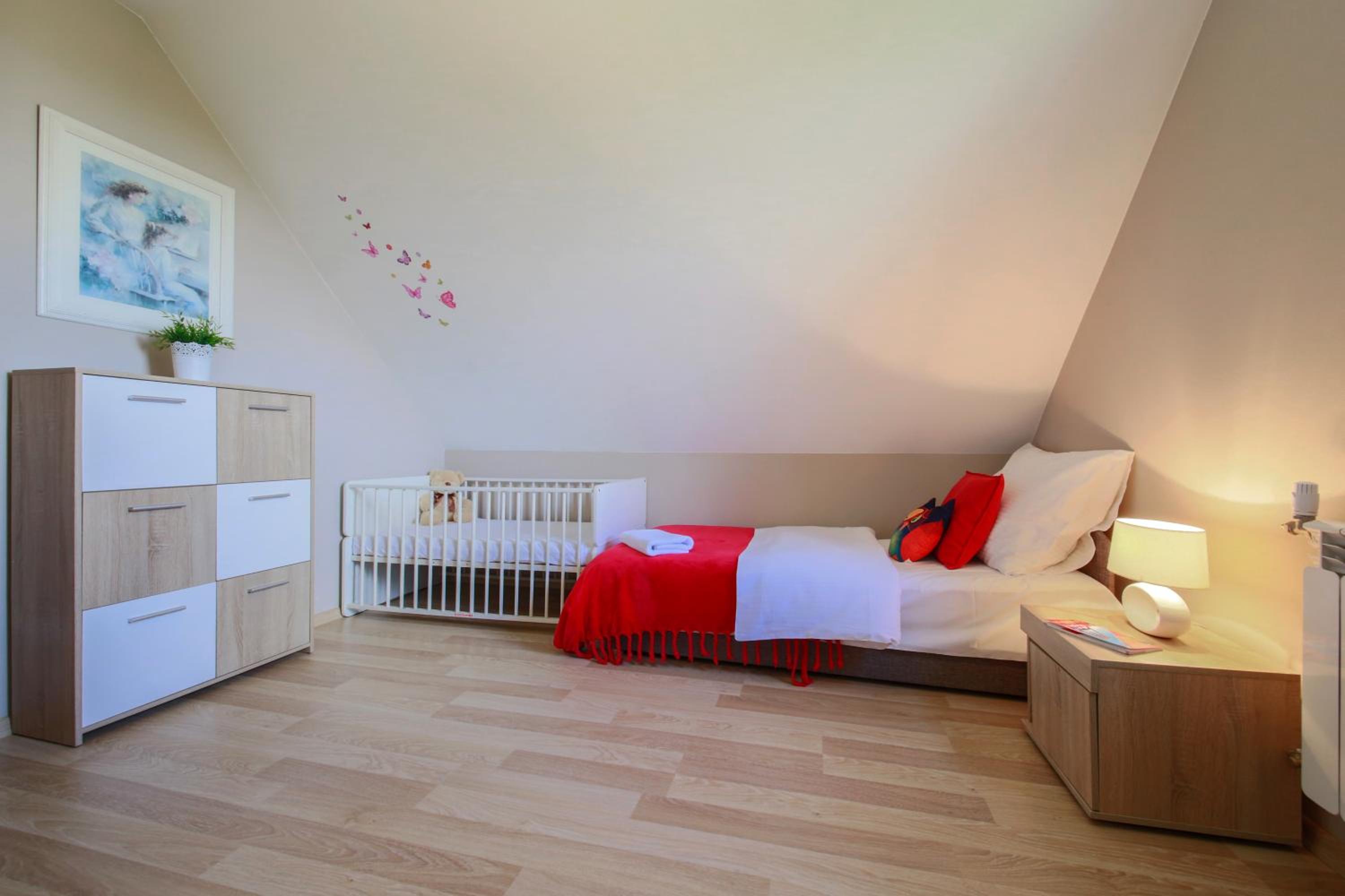 Three-Bedroom Apartment - Photo 2