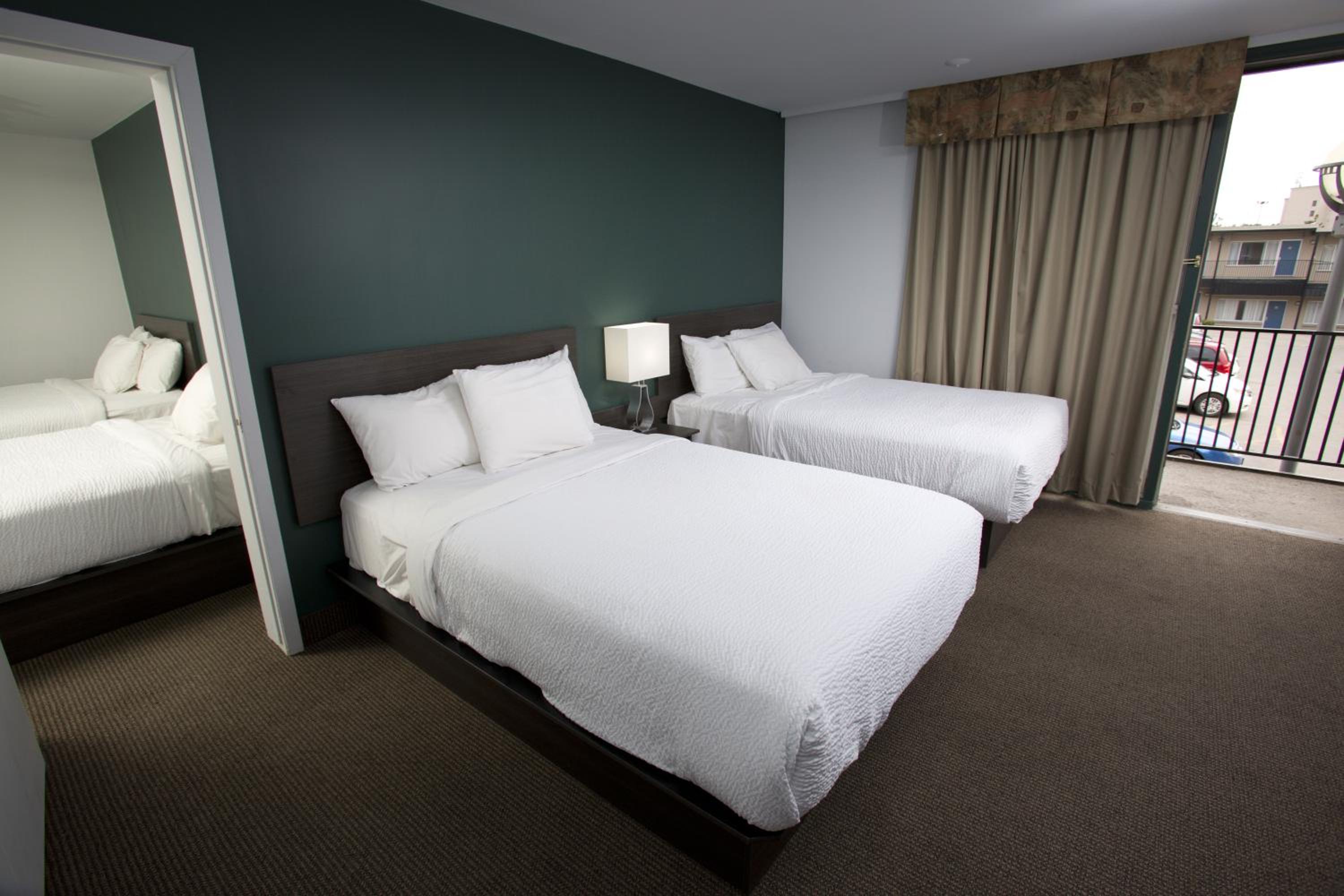 Motel Two Bedroom Suite with Four Double Beds- Exterior Entrance - Photo 2