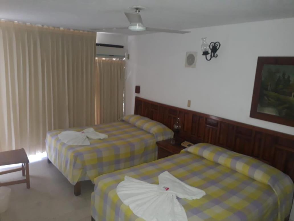 Queen Room with Two Queen Beds - Photo 1