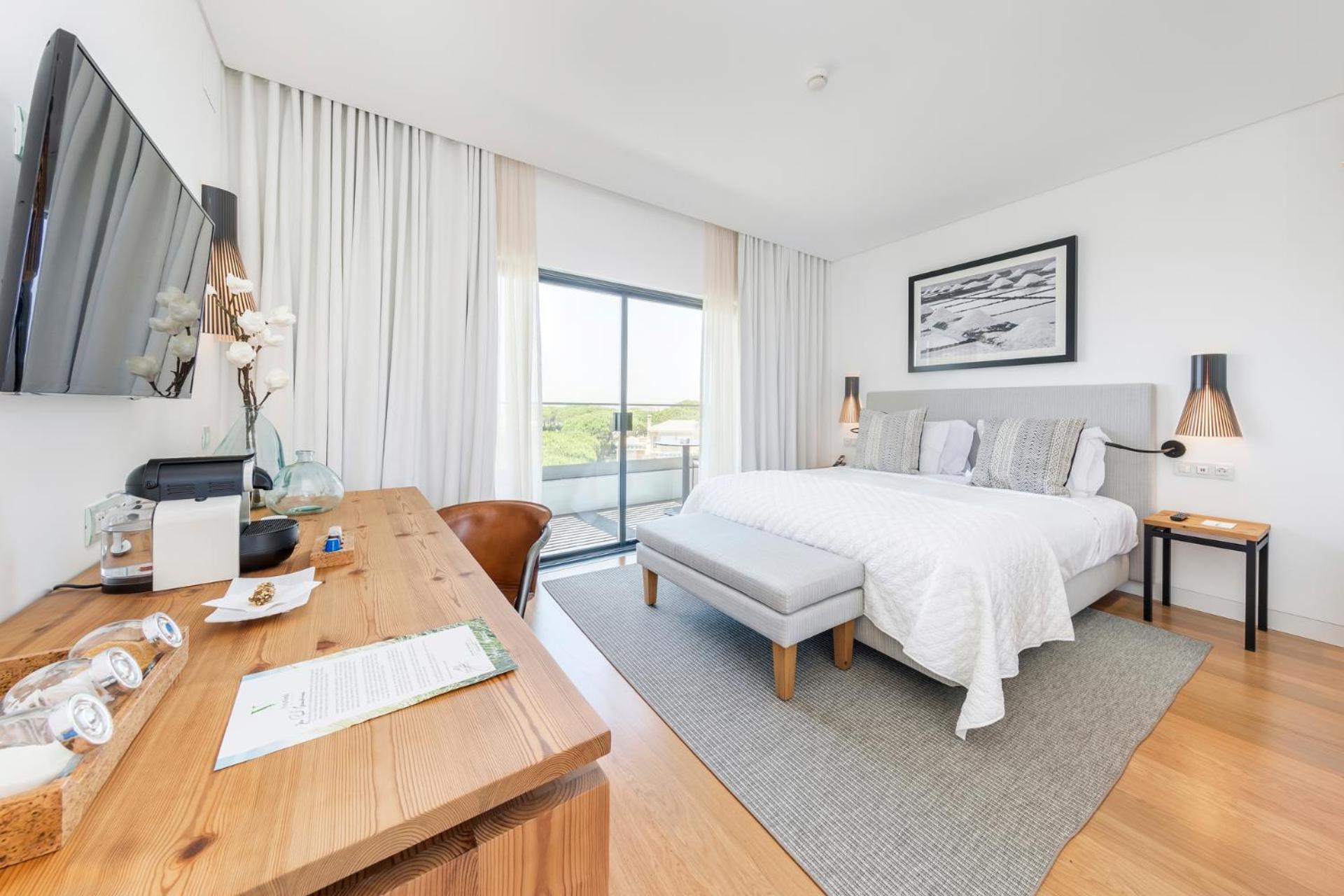 bedroom with a large bed and a flat screen tv