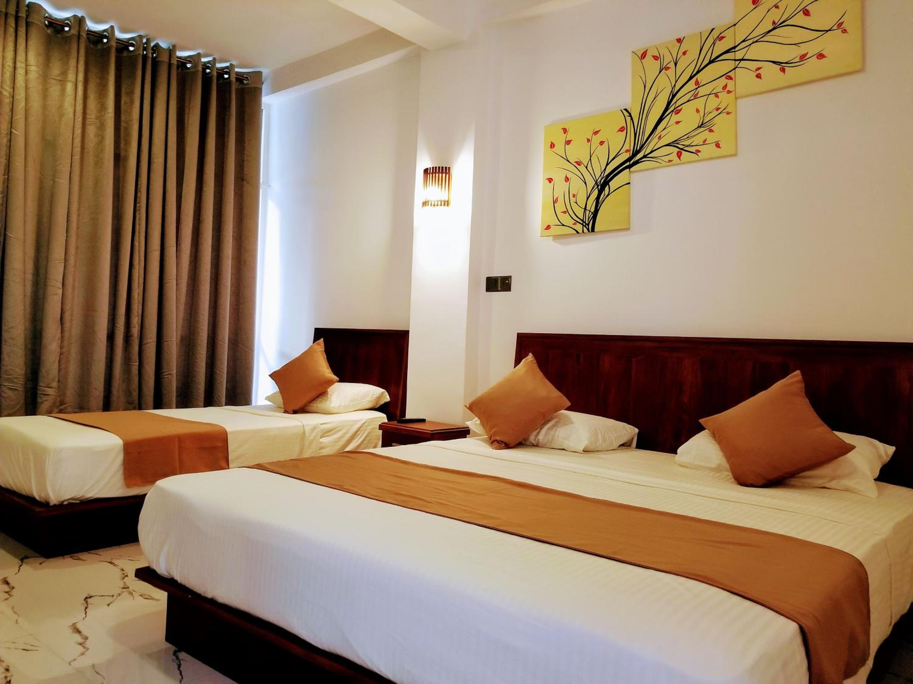 Deluxe Triple Room with Balcony photo 1
