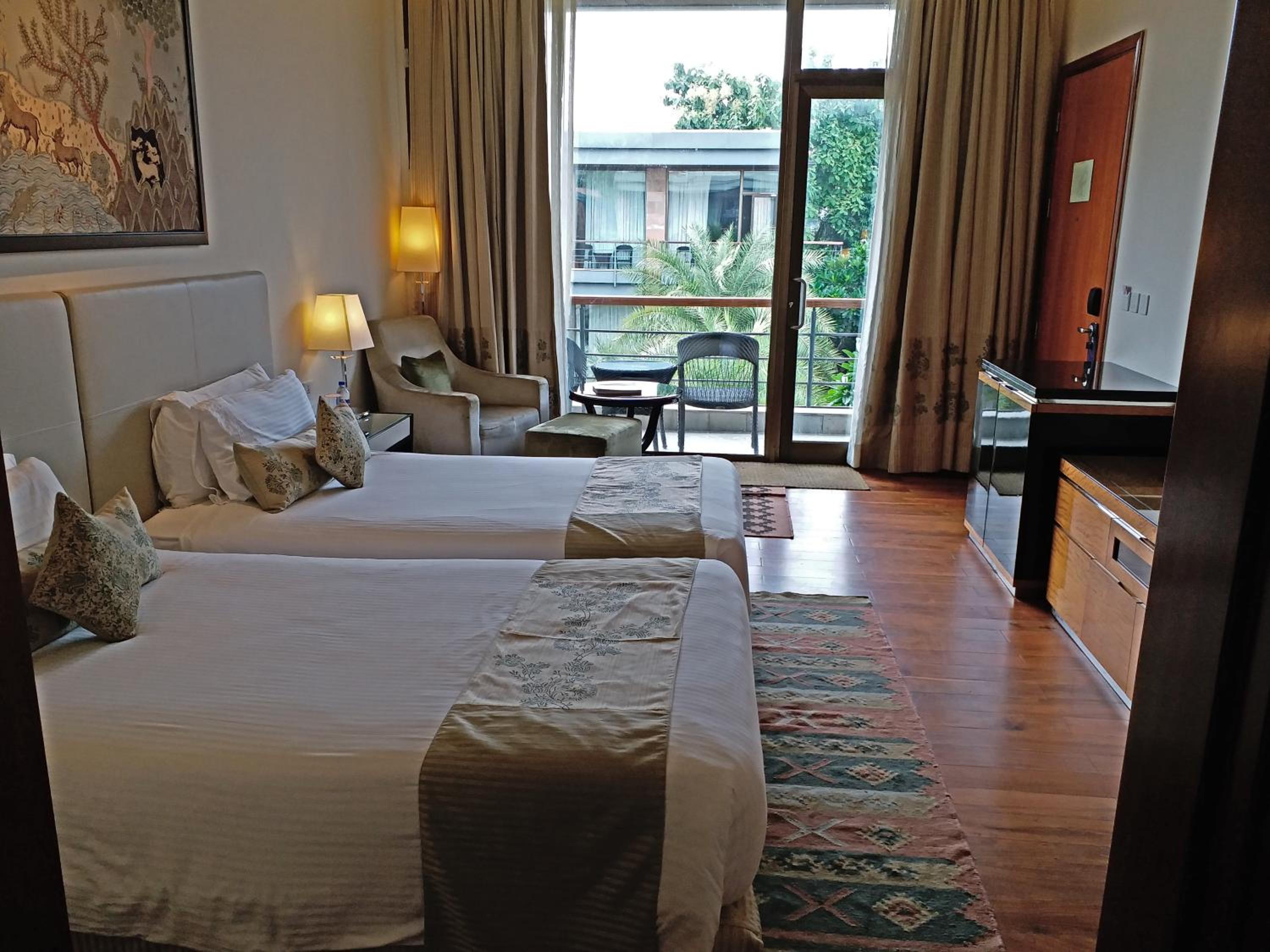 Luxury Room Courtyard View with Balcony  – Twin Bed at Taj Damdama Lake Resort & Spa, Gurugram