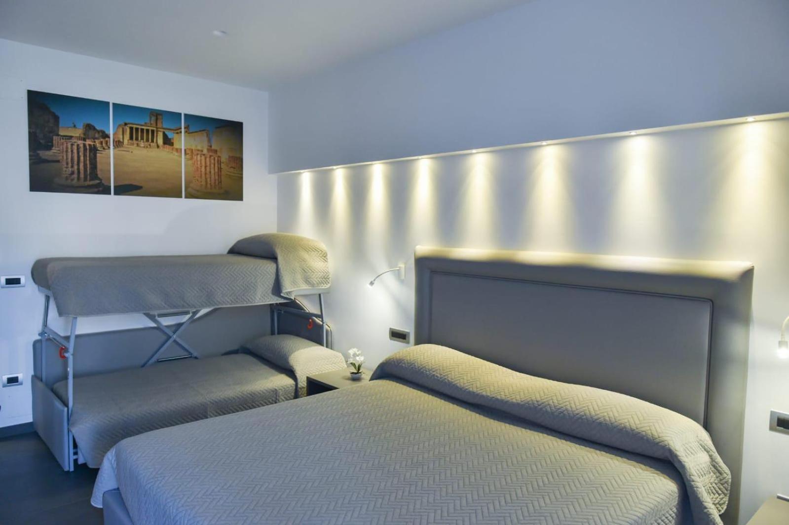 Quadruple Room with Balcony - Photo 23
