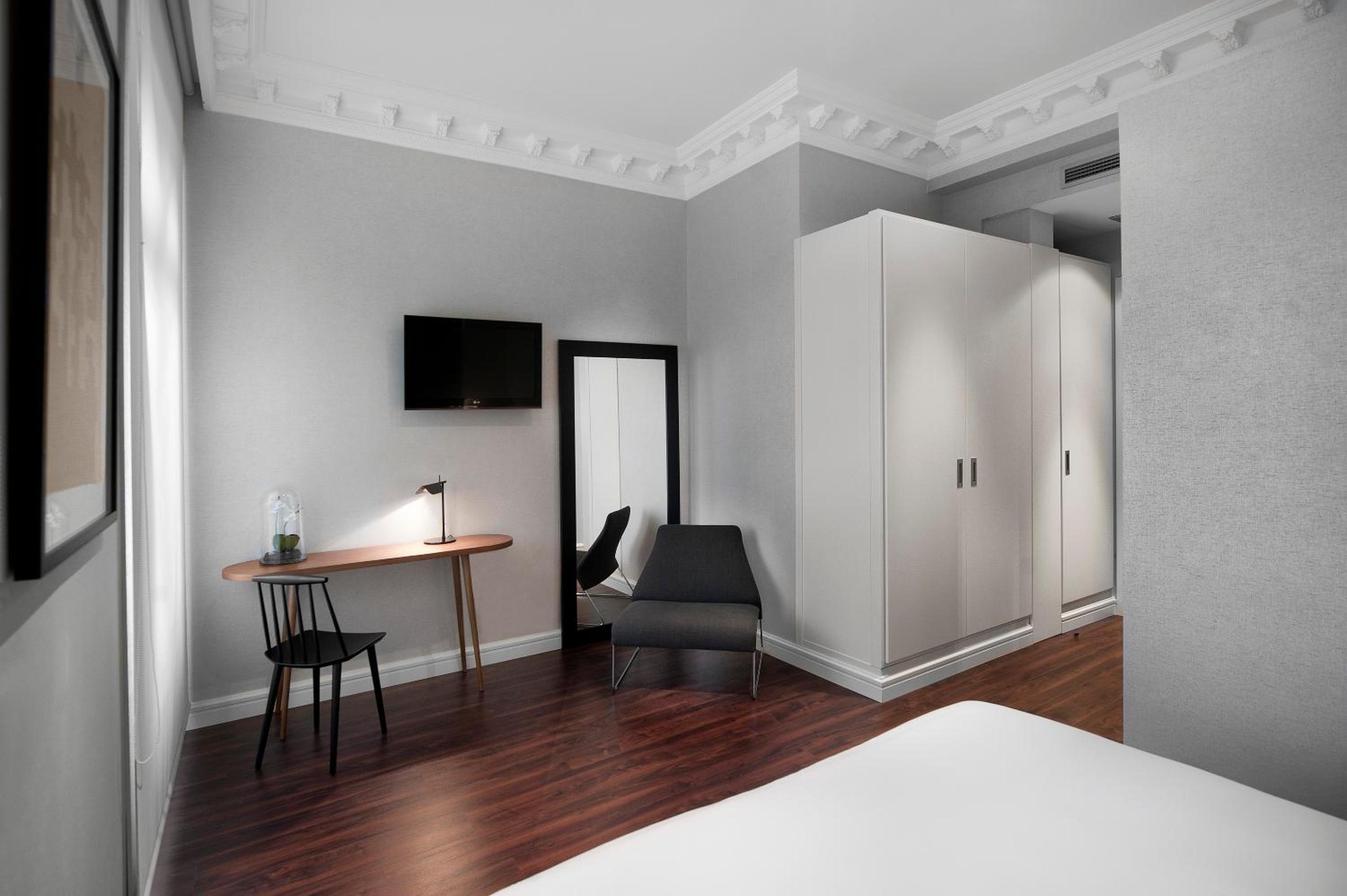 Habitación Doble Deluxe con cama extra (2 adultos + 1 niño)
