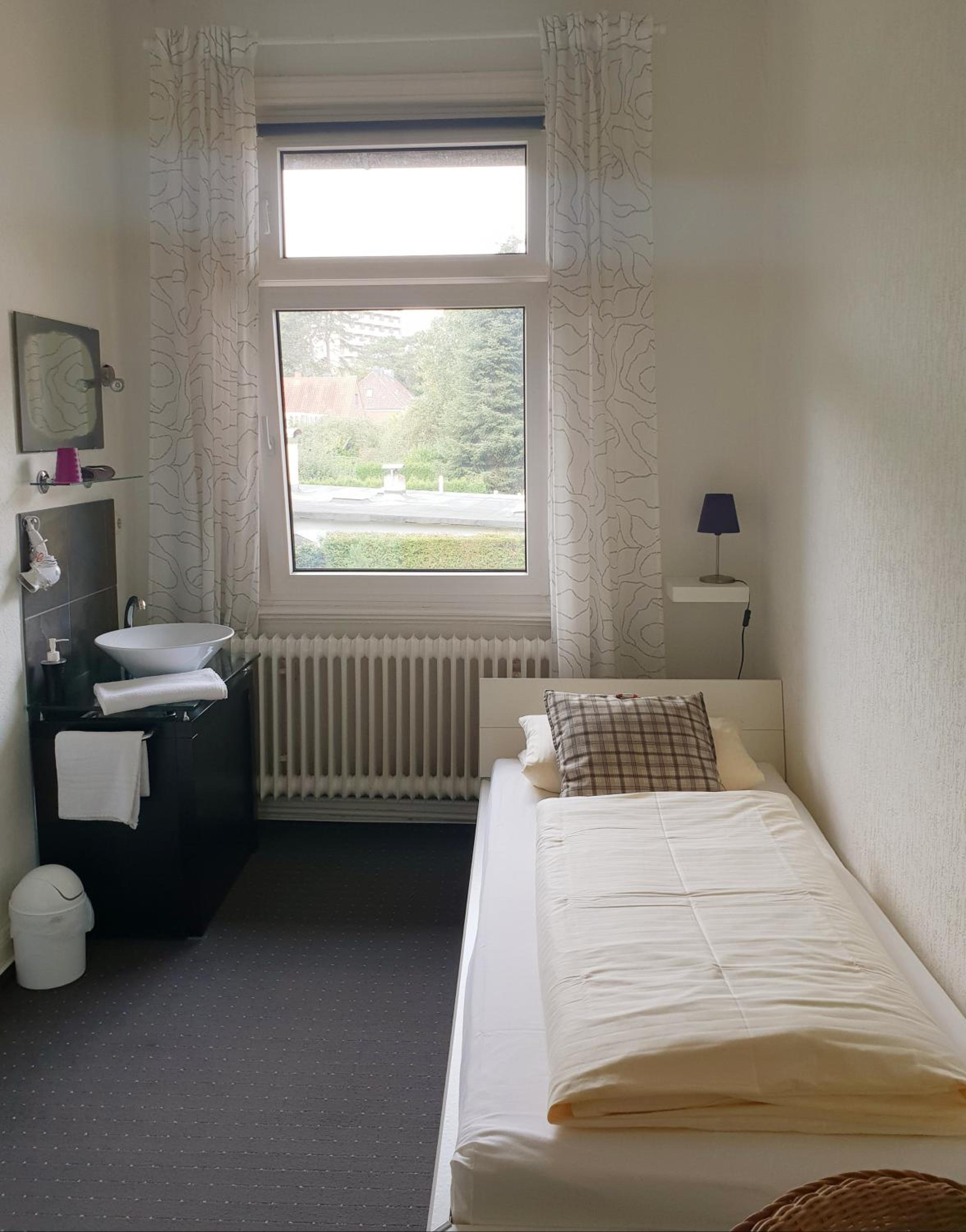 Single Room with Shared Shower and Toilet