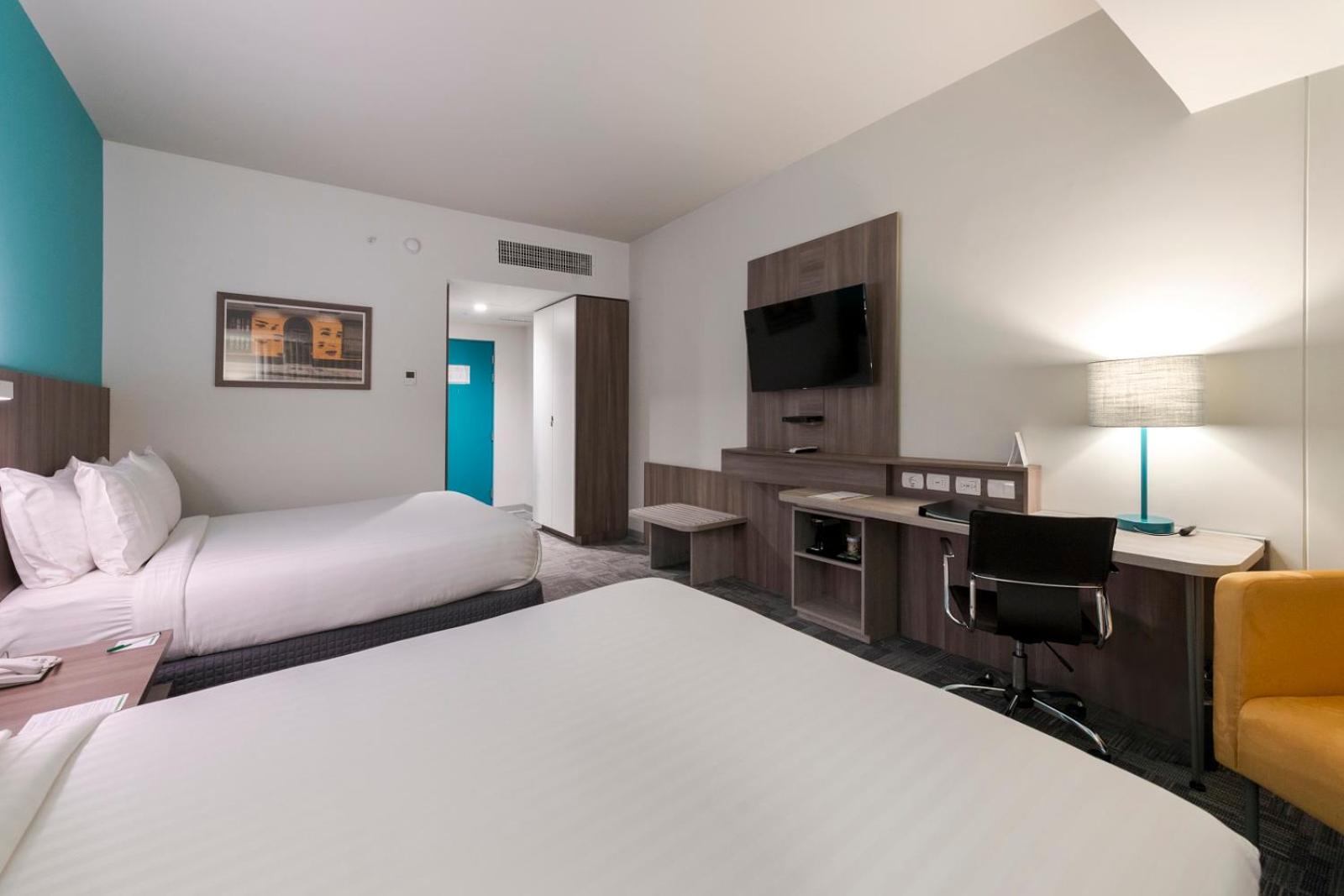 Standard Queen Room with Two Queen Beds - Top Floor photo 1