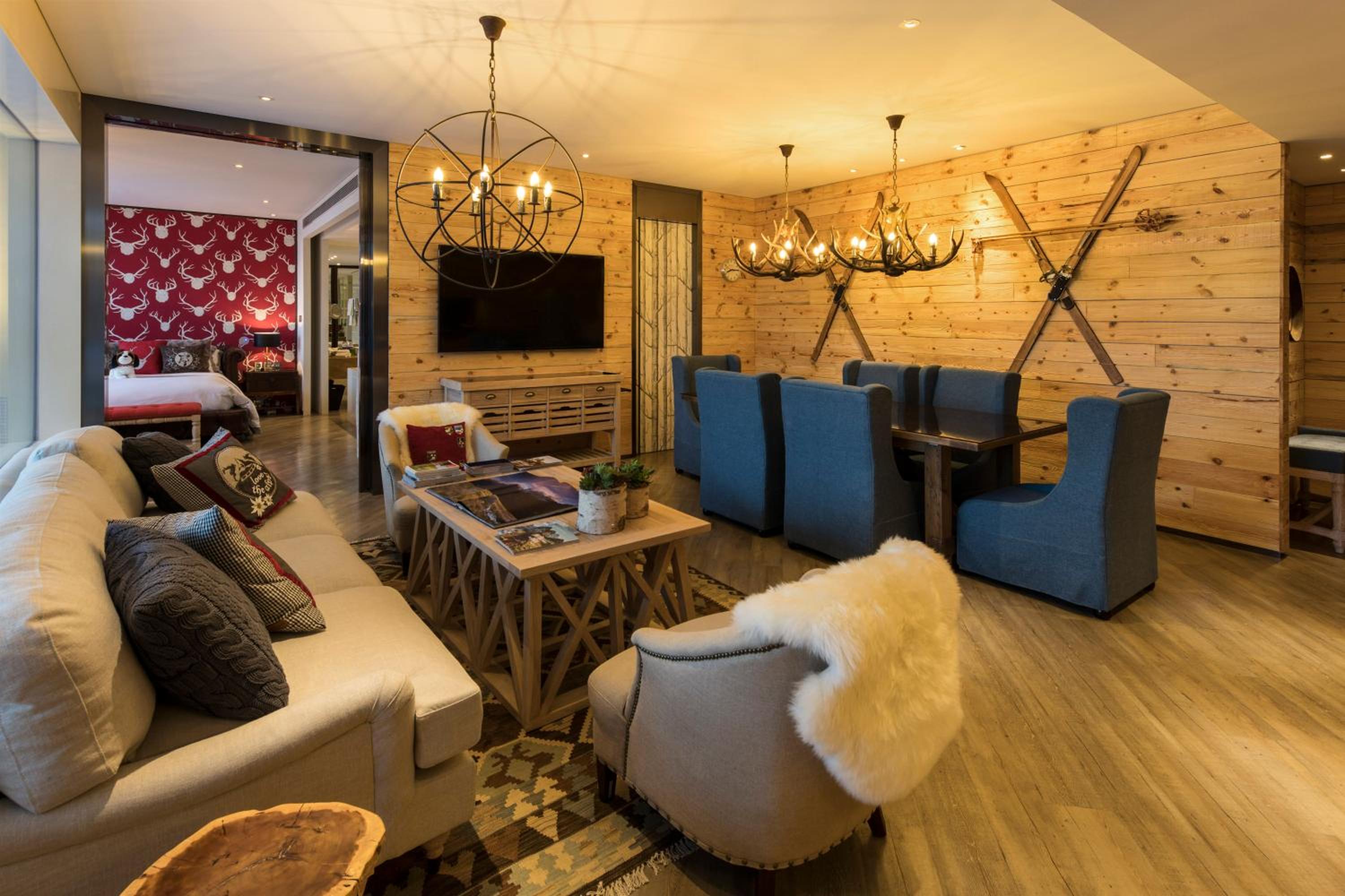 living room with couches, chairs, and a flat screen tv