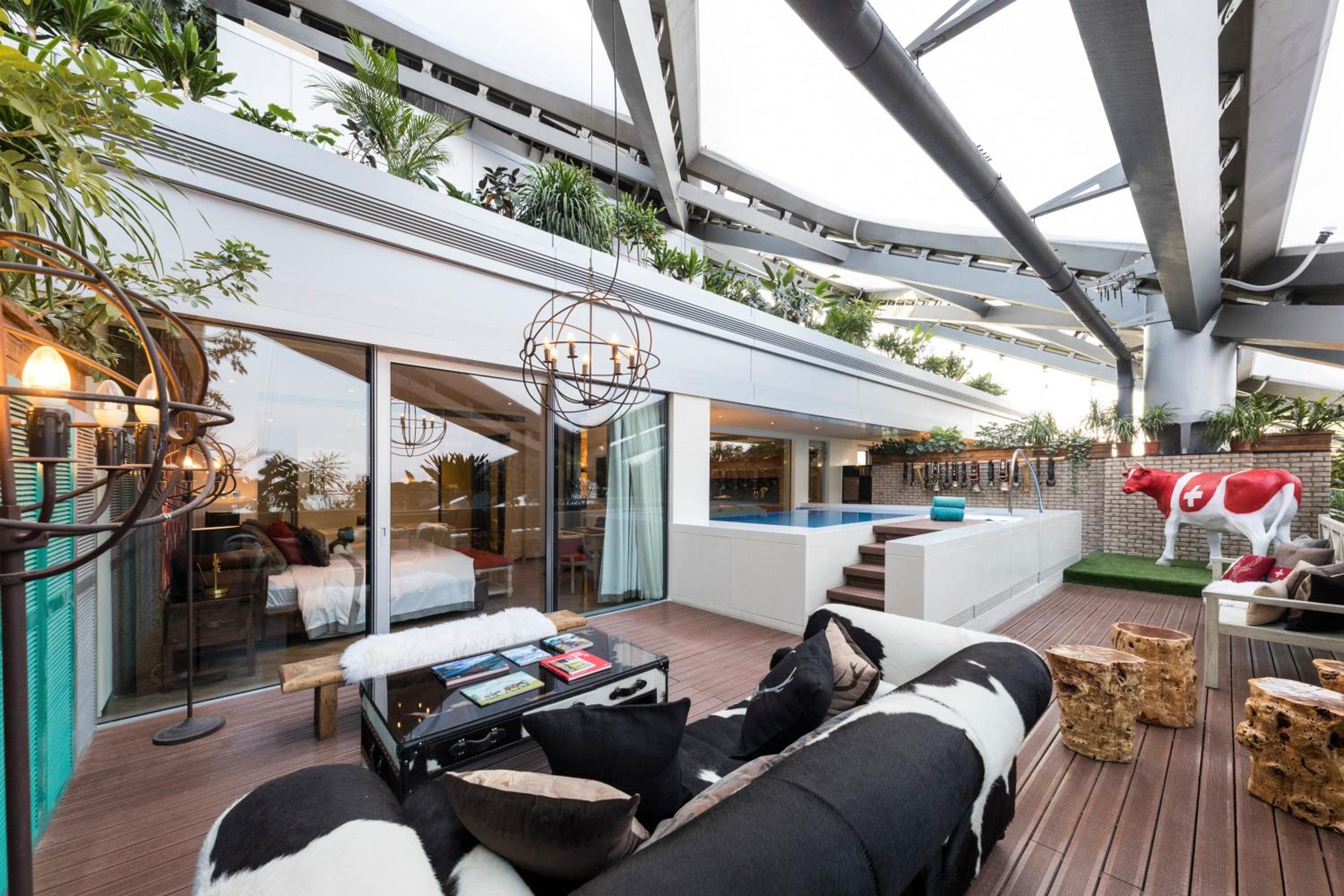 living room with a view of the pool and patio