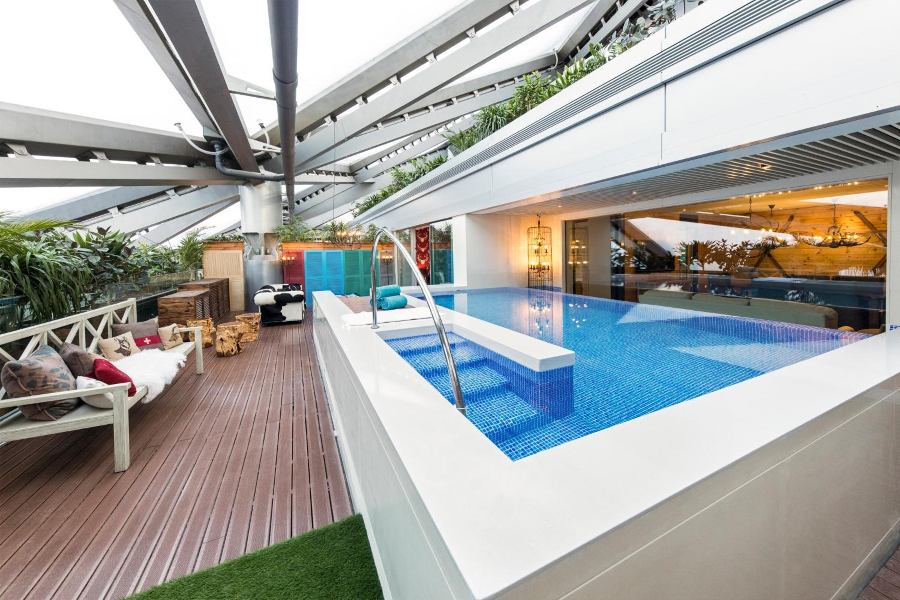 swimming pool on the roof of a house in miami