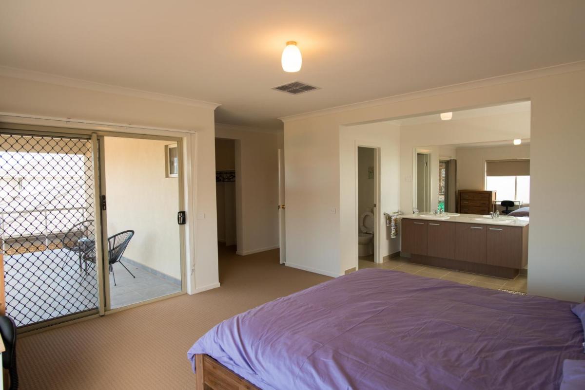 Ensuite Master Bedroom with Balcony  photo 1