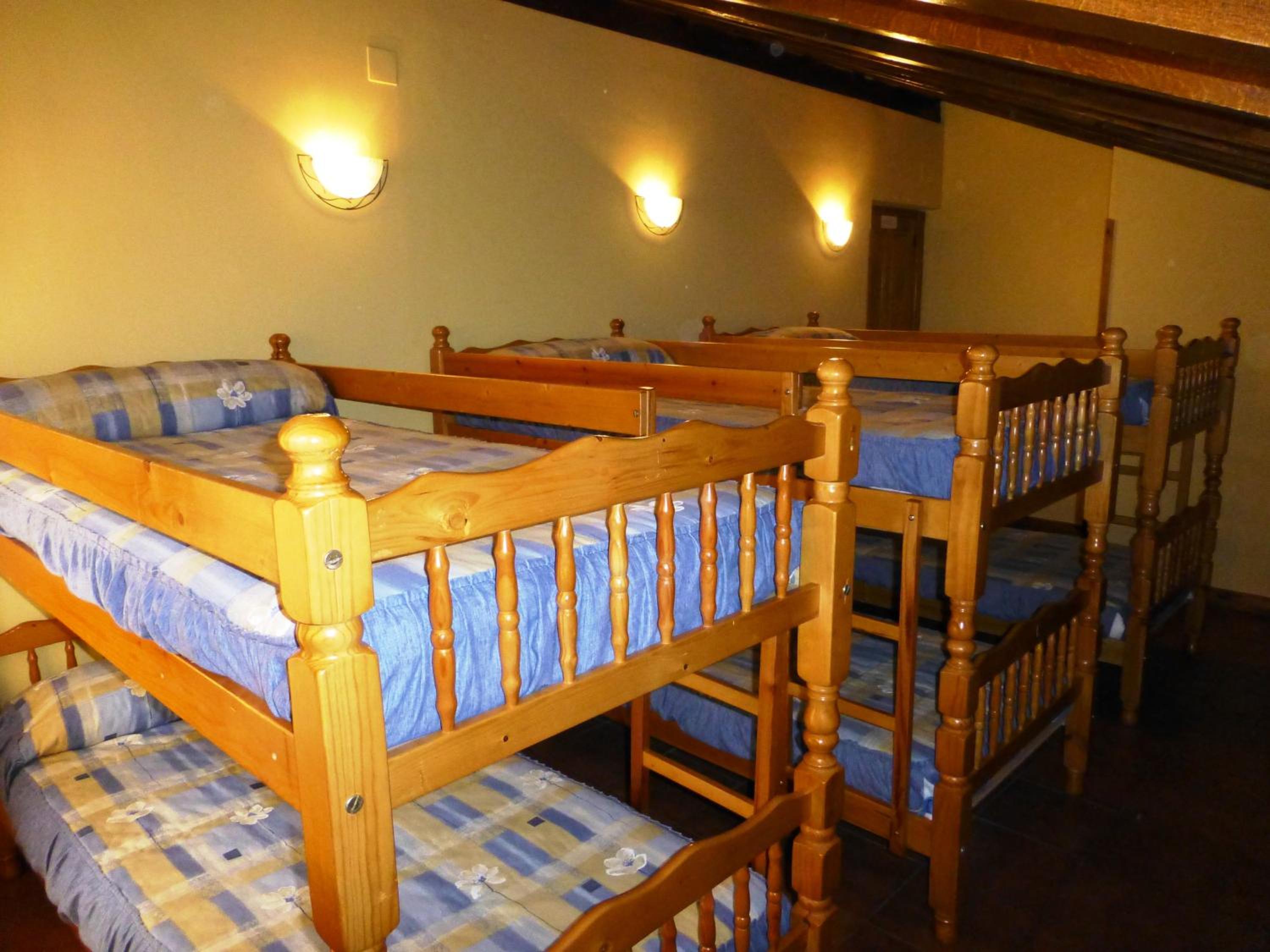 Cama en habitación compartida de 6 camas