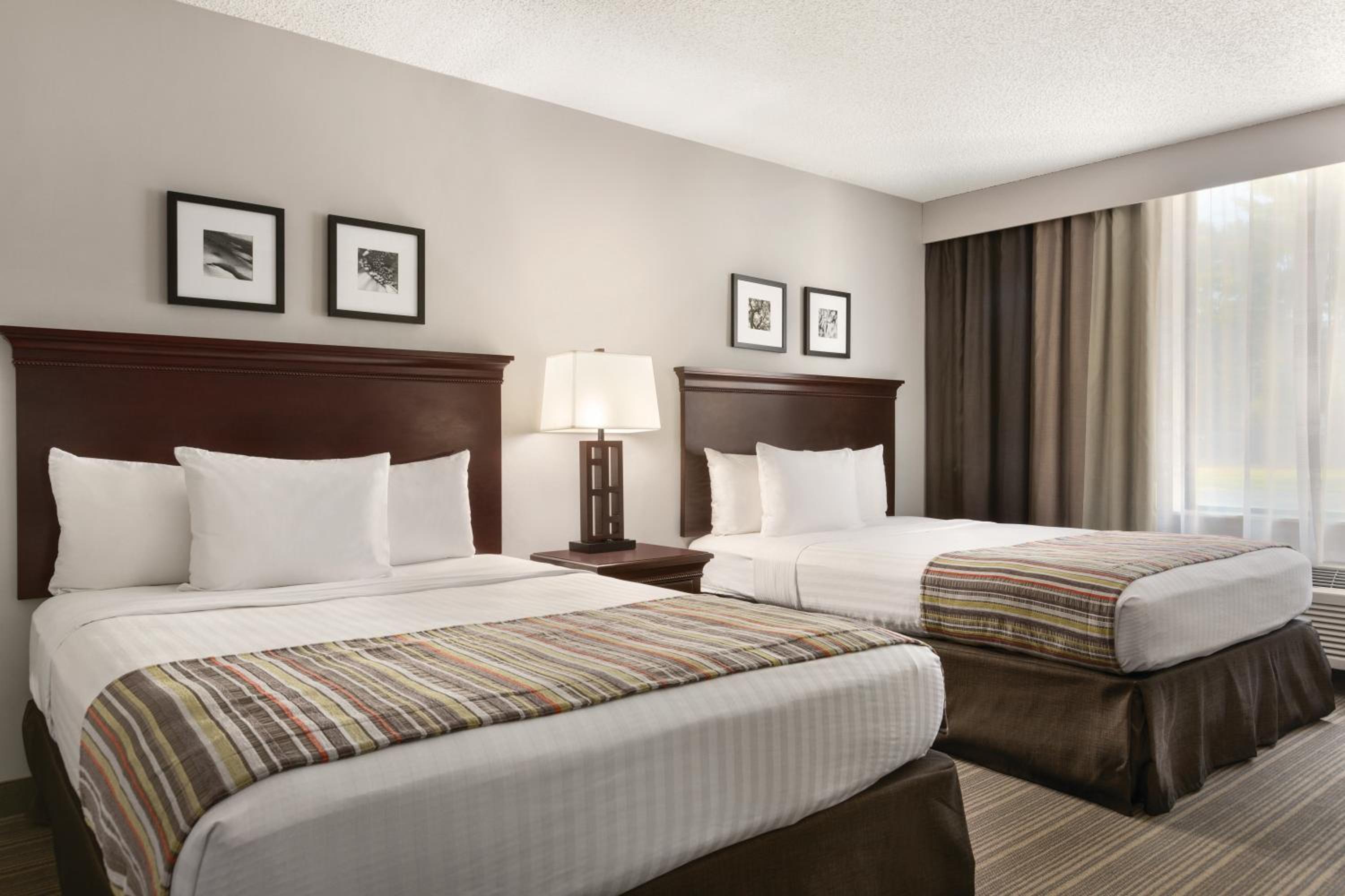 Queen Room with Two Queen Beds - Photo 1