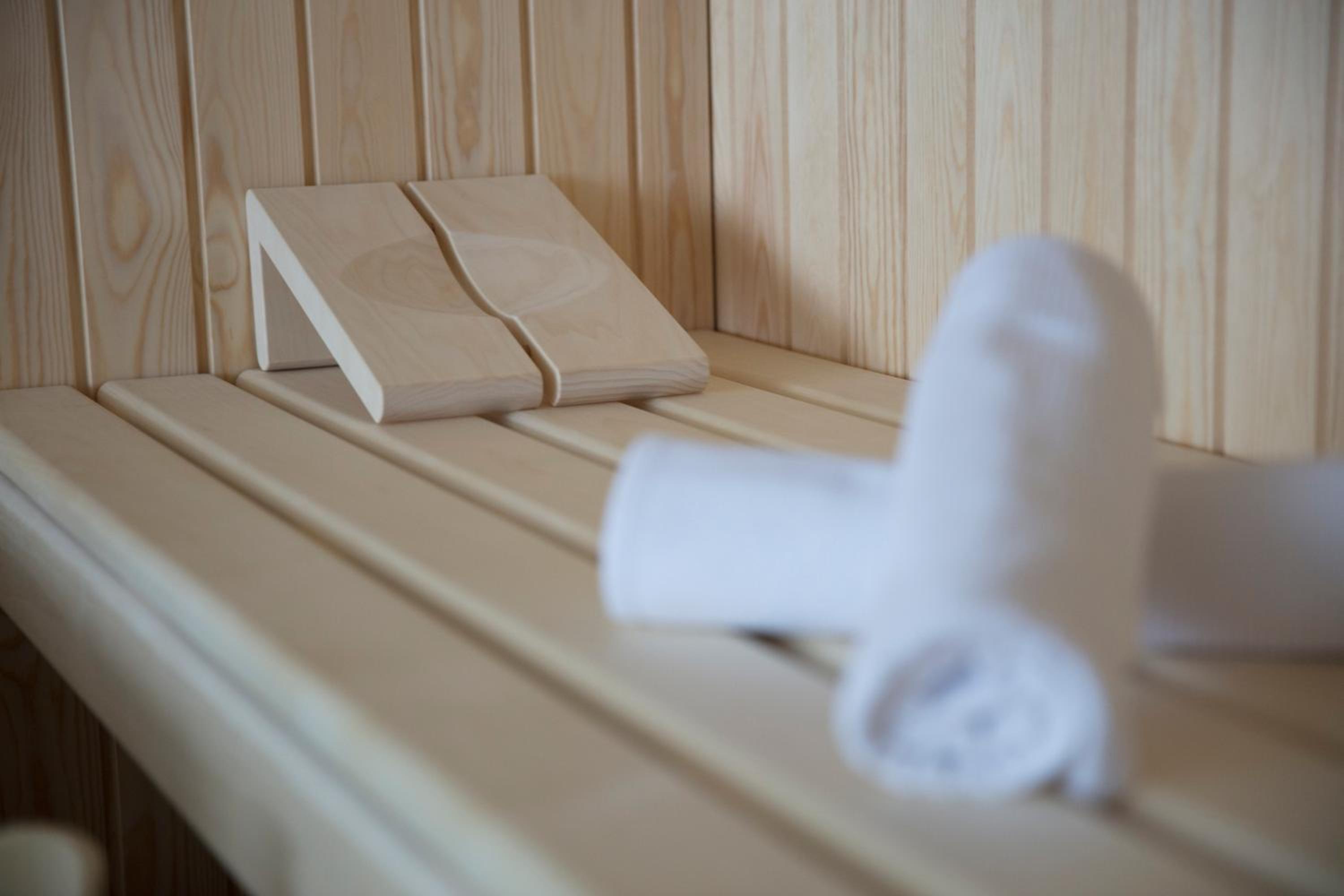 sauna room with two towels and a towel holder