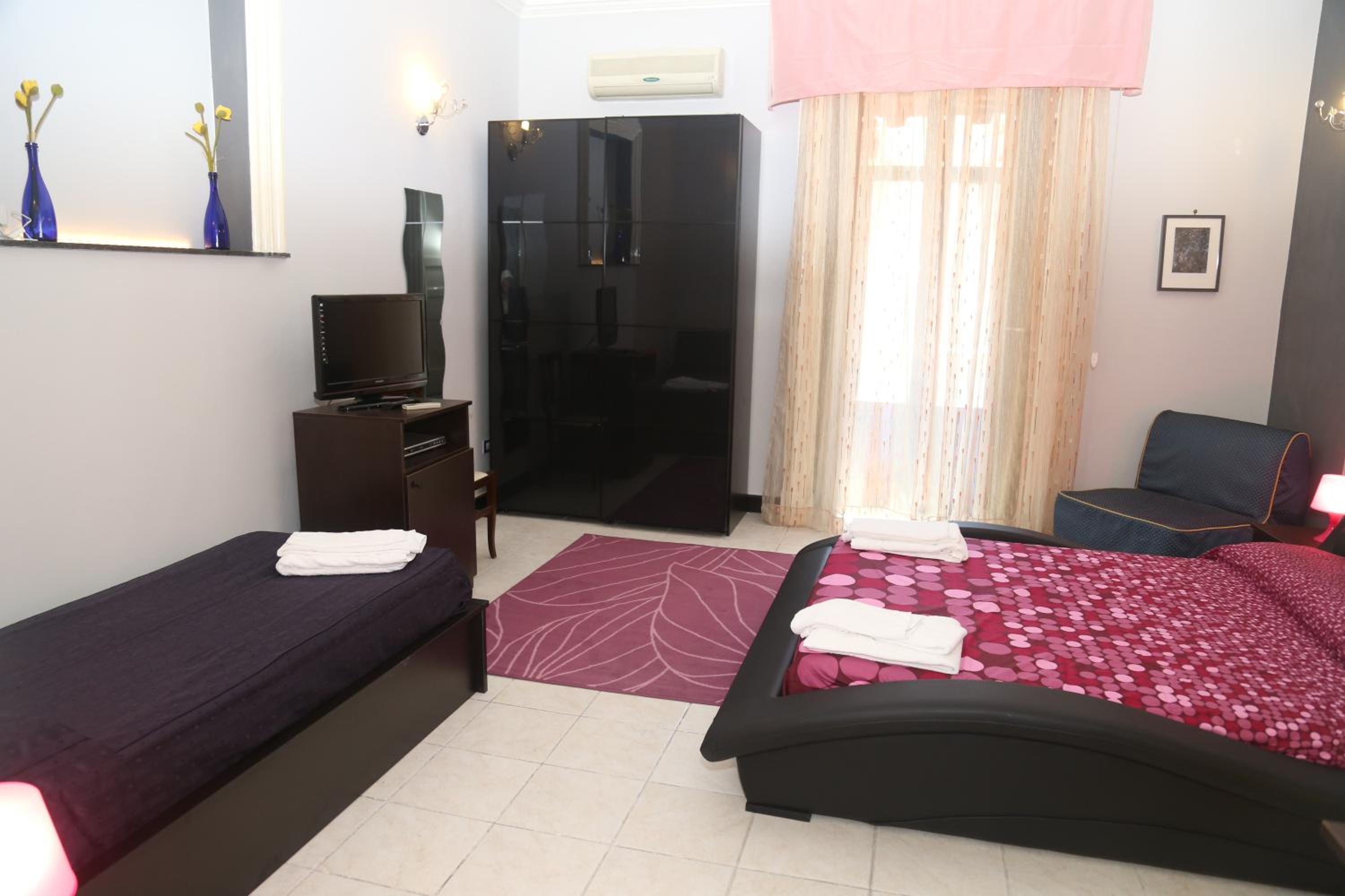Deluxe Quadruple Room with Balcony