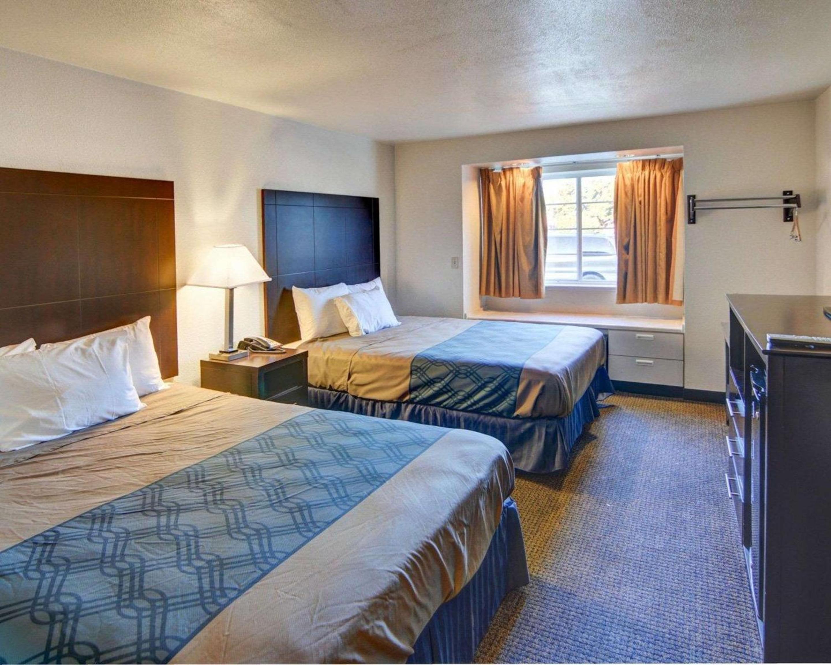 Queen Room with Two Queen Beds - Smoking - Photo 1