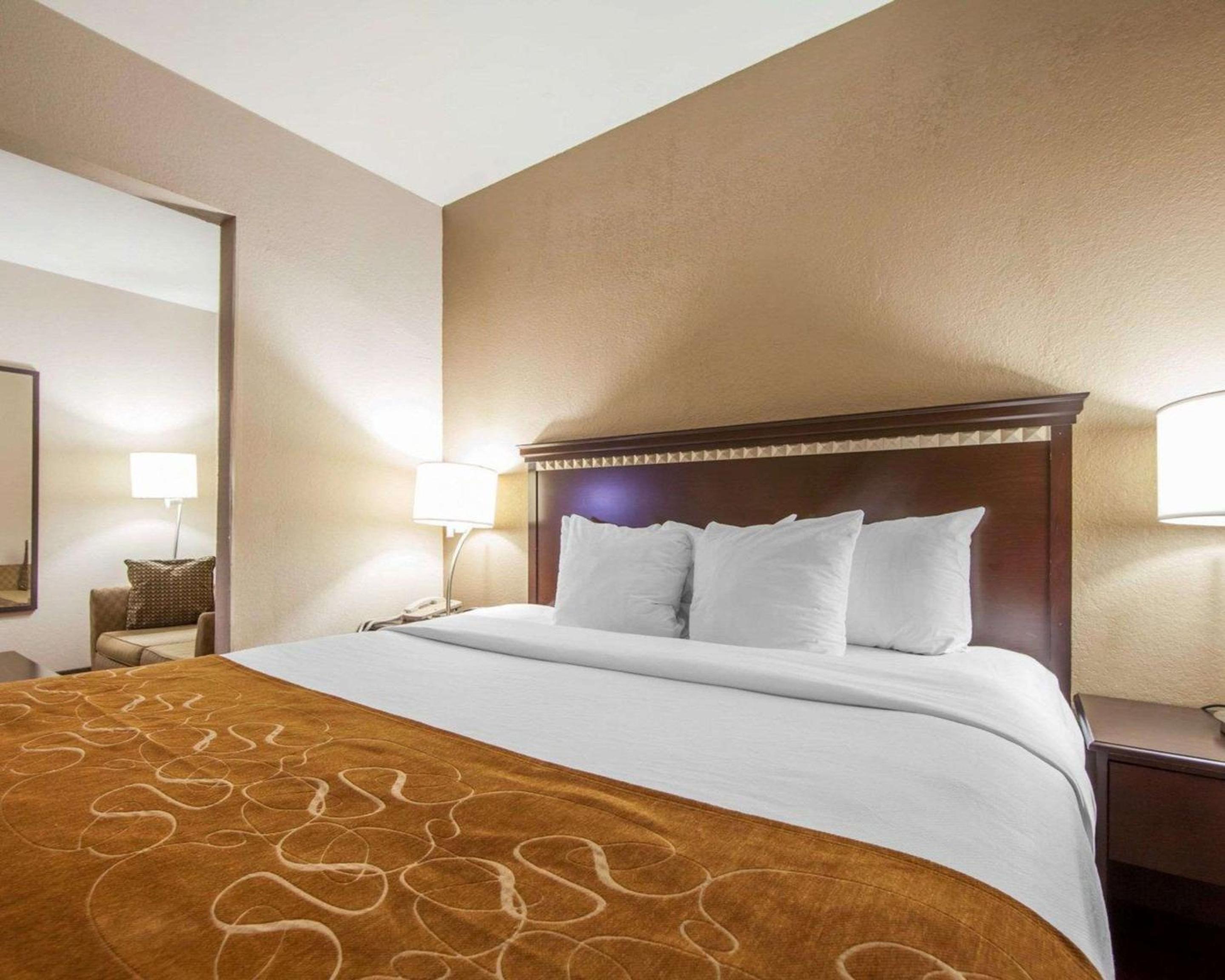 hotel room with a king size bed and a flat screen tv