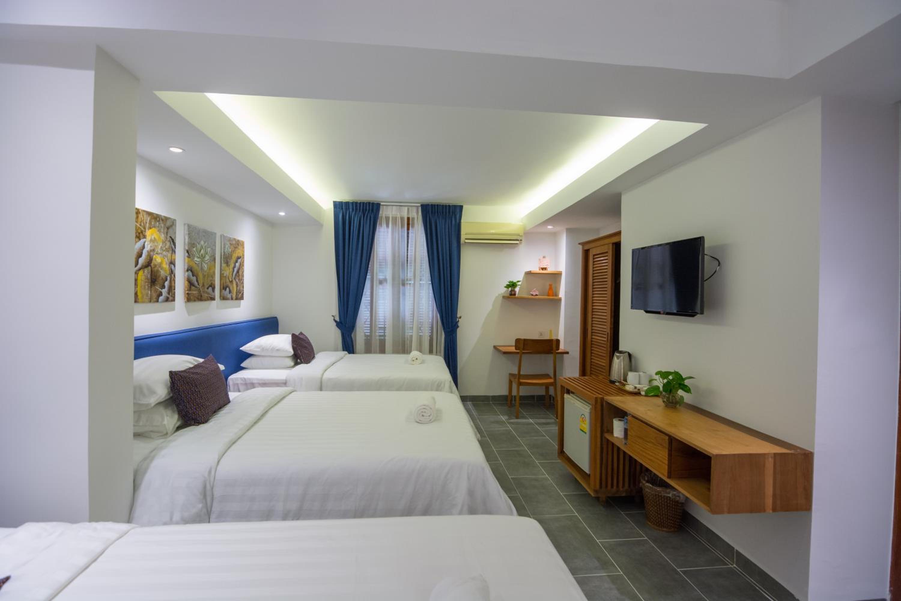Deluxe Triple Room - Photo 1