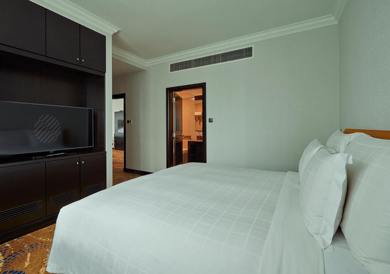 Two-Bedroom Apartment with One King Bed and Two Single Beds photo 2