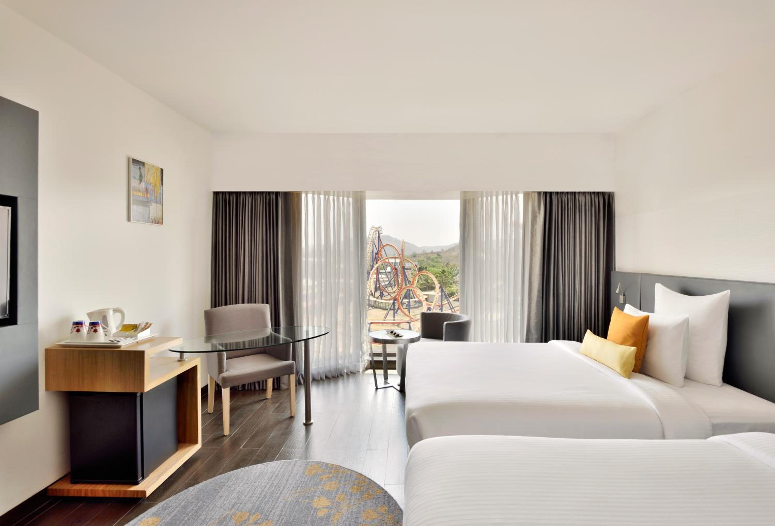 Classic Family Room with Two Queen Beds with Complimentary one free ticket for Trampoline Park at Imagicaa per room per stay and 20% discount on Food and Beverage - Photo 1