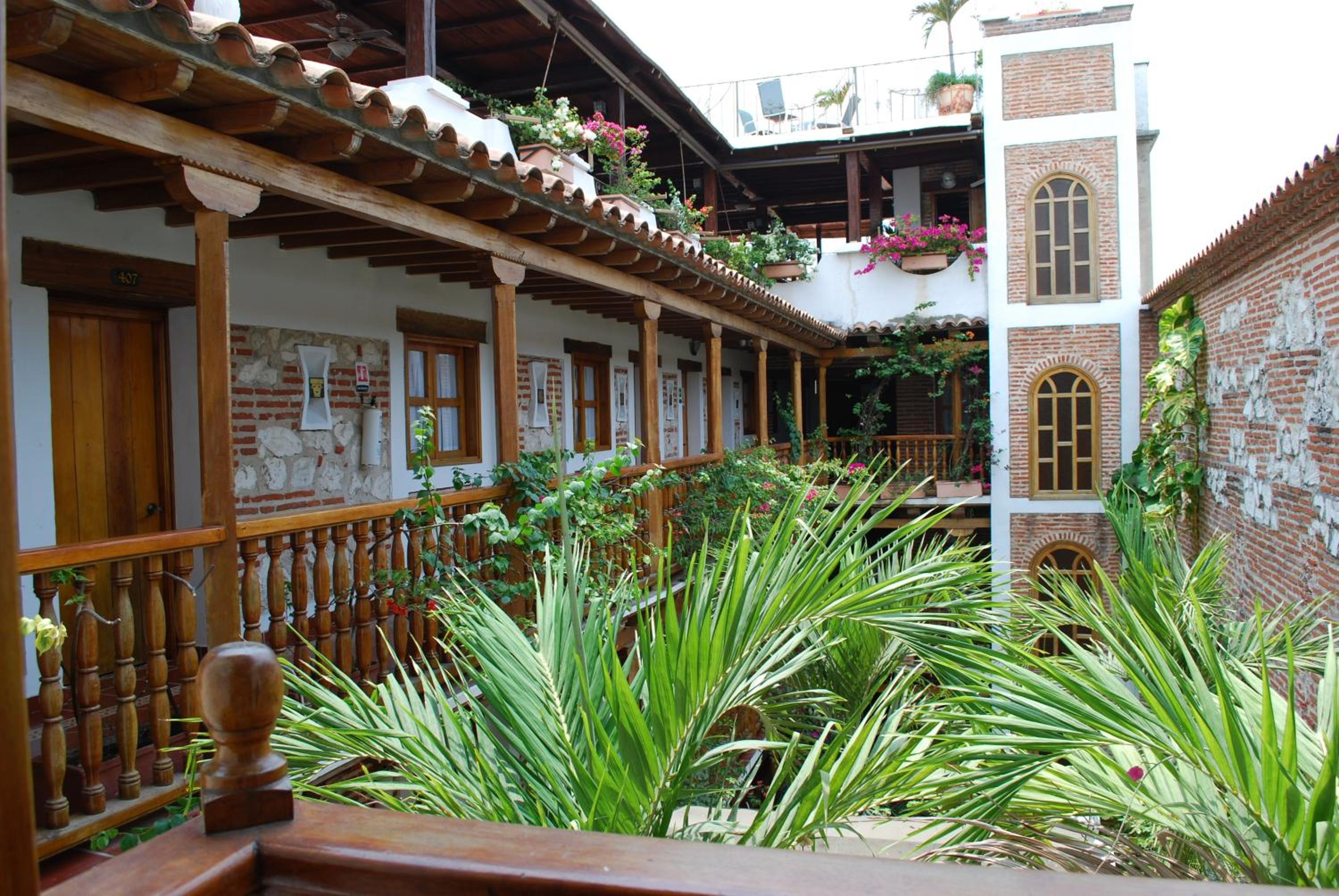 Deluxe Room with Balcony - Photo 13