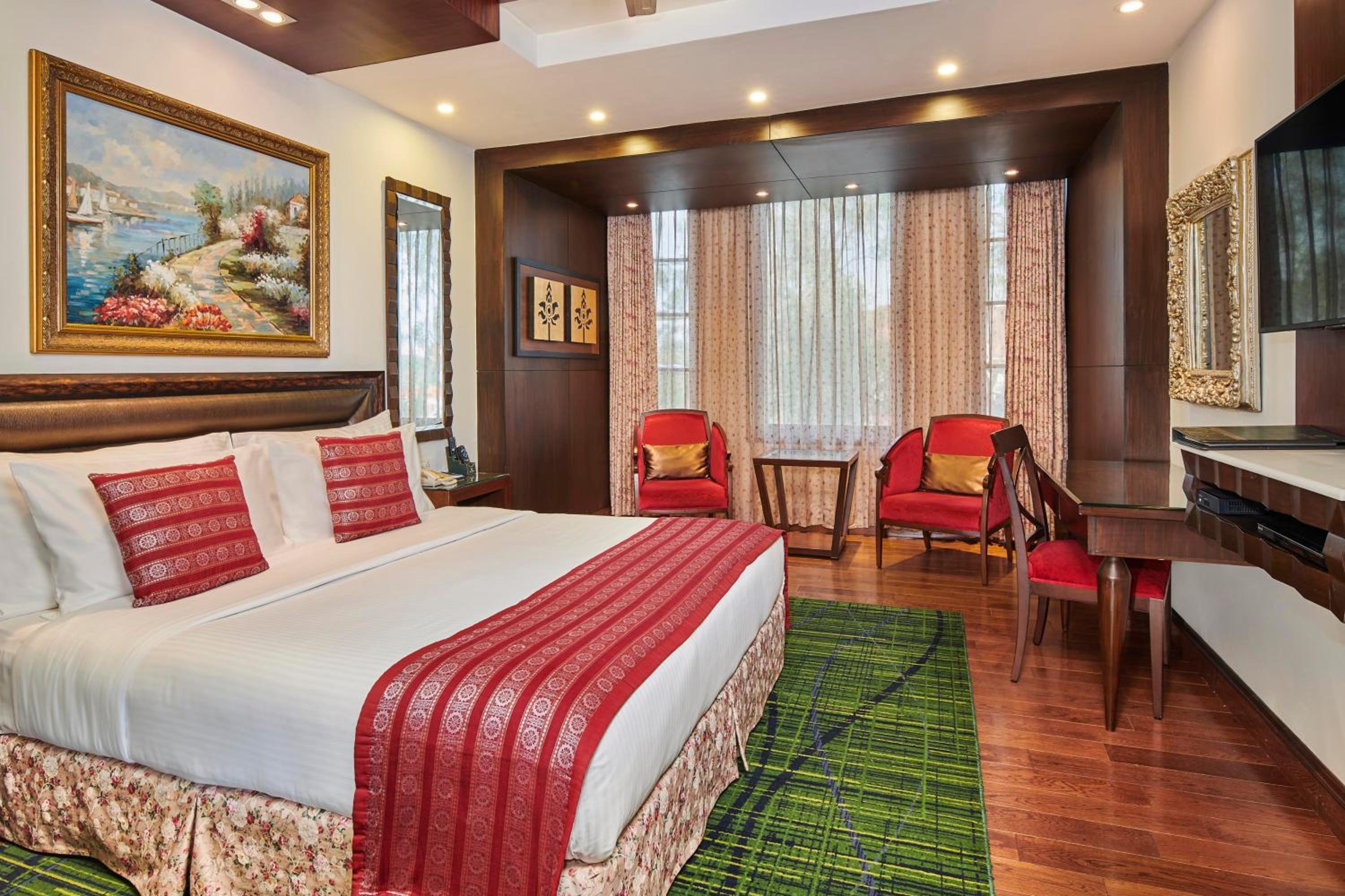 Deluxe King Room - 10% Discount on Foods & Soft Beverages* | 15% Discounts on Laundry Services* | Free Mini-bar - 2 cans of soft Beverages (Once on Arrival) | Assorted Snacks in the Room (Once during Stay)