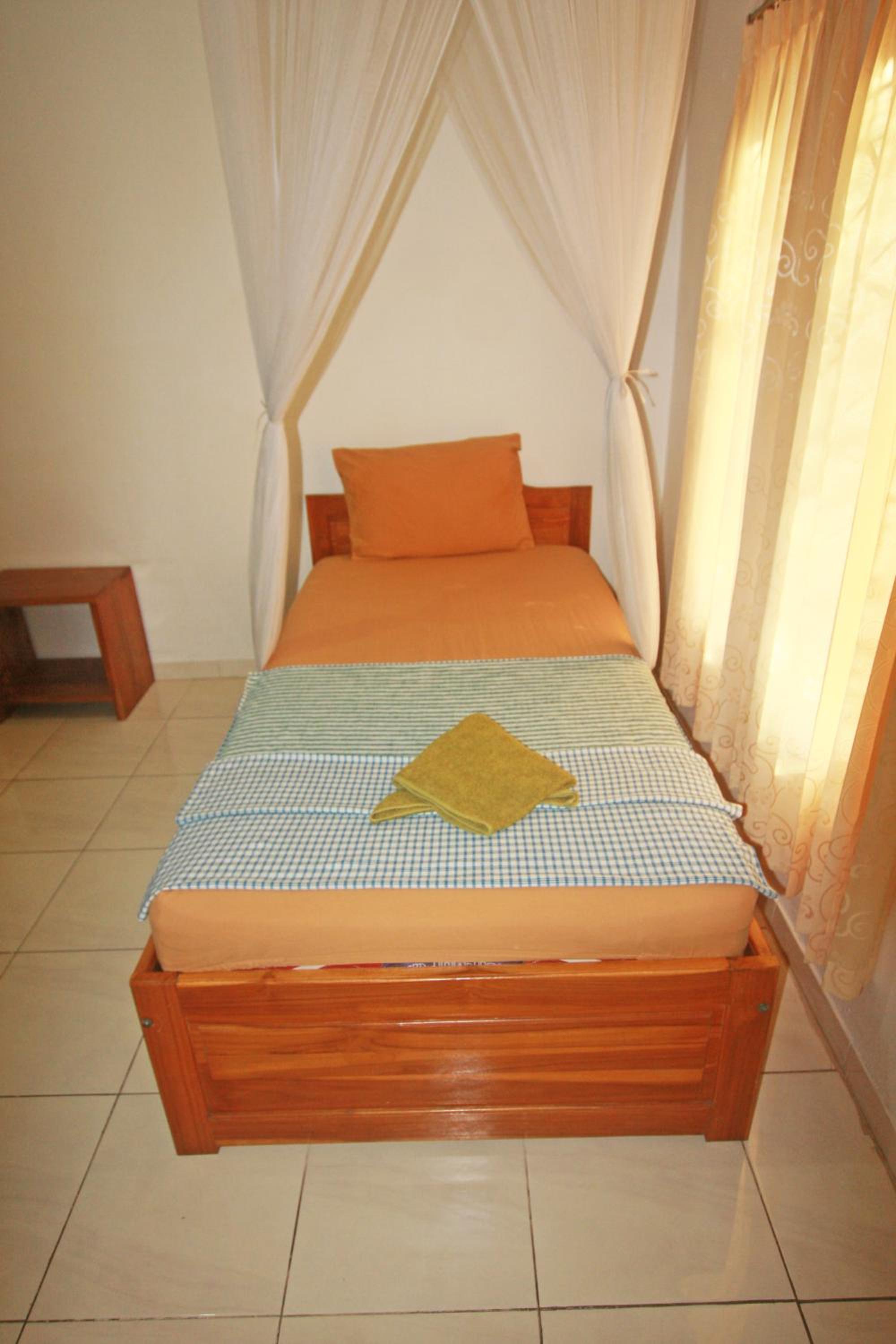 Standard Triple Room with AC photo 1