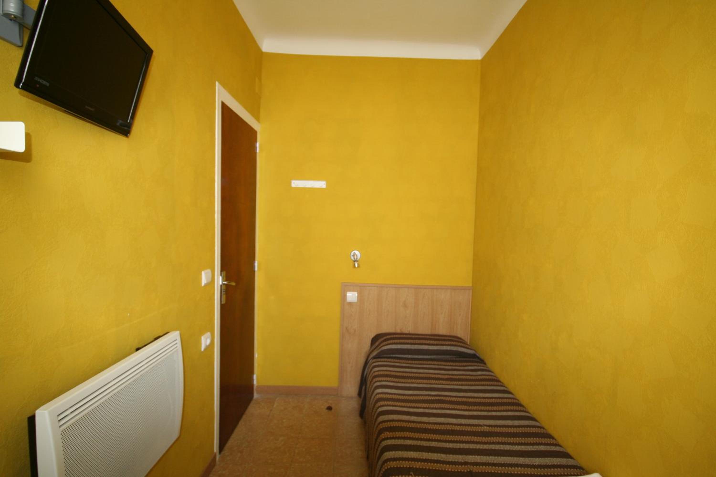 Habitación individual con baño compartido