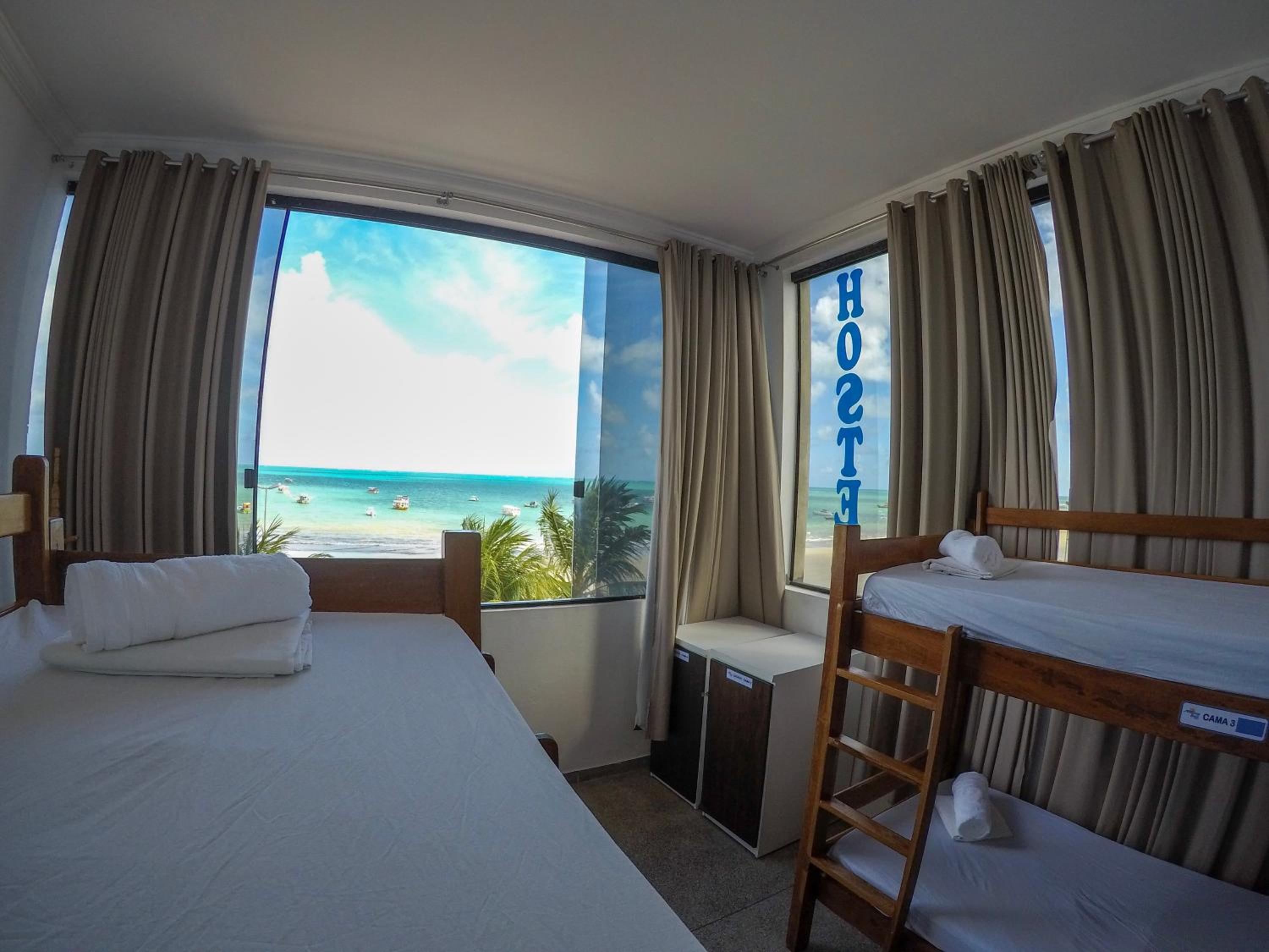 Cama em Dormitório Misto com 4 Camas e Vista do Mar photo 1