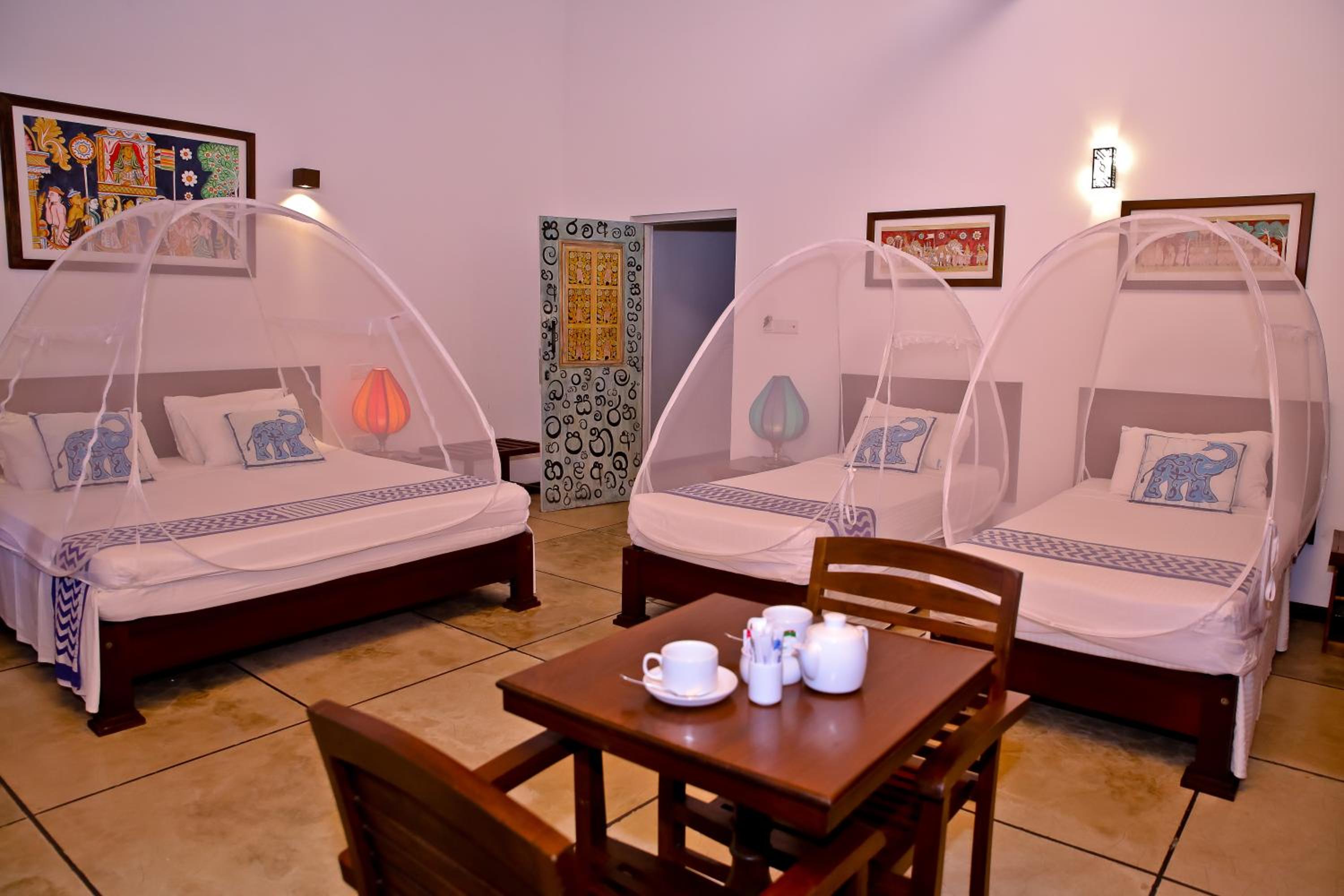 Quarto Quádruplo com Varanda e Vista para o Jardim (Check-in Antecipado e Check-out Tardio sujeitos à disponibilidade)