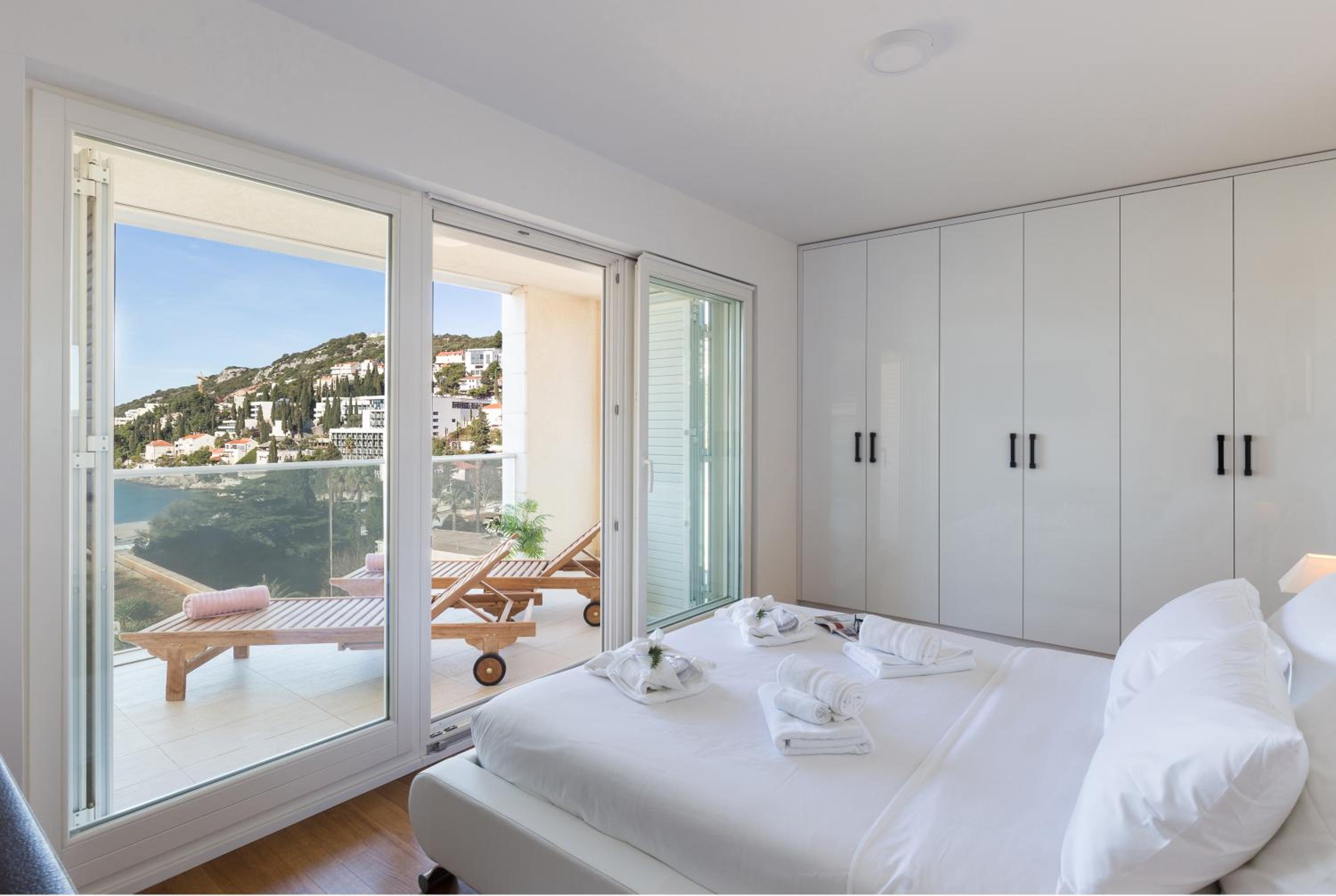 Deluxe Three-Bedroom Apartment with Balcony and Partial Sea View
