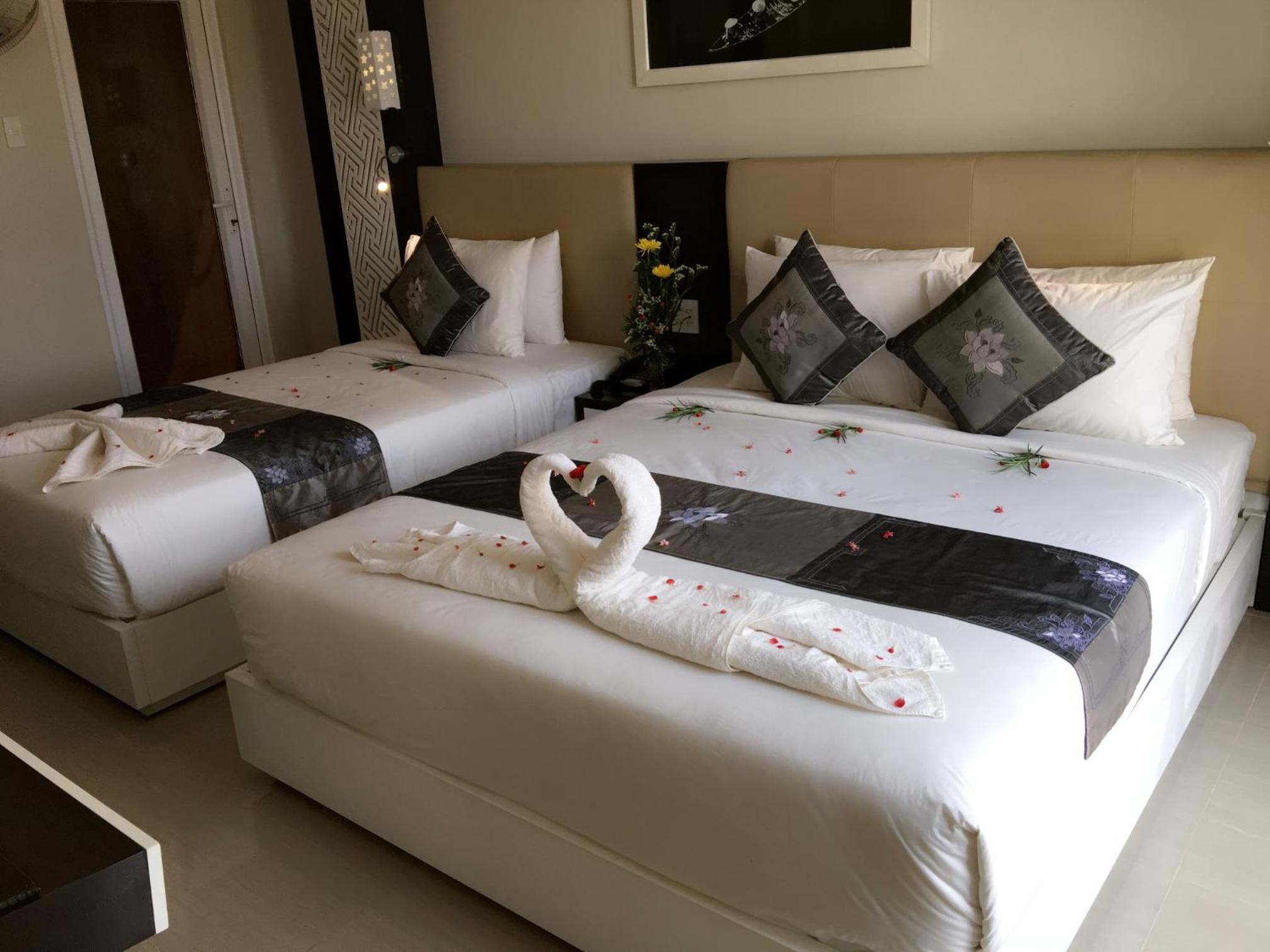 Deluxe Triple Room - Photo 9
