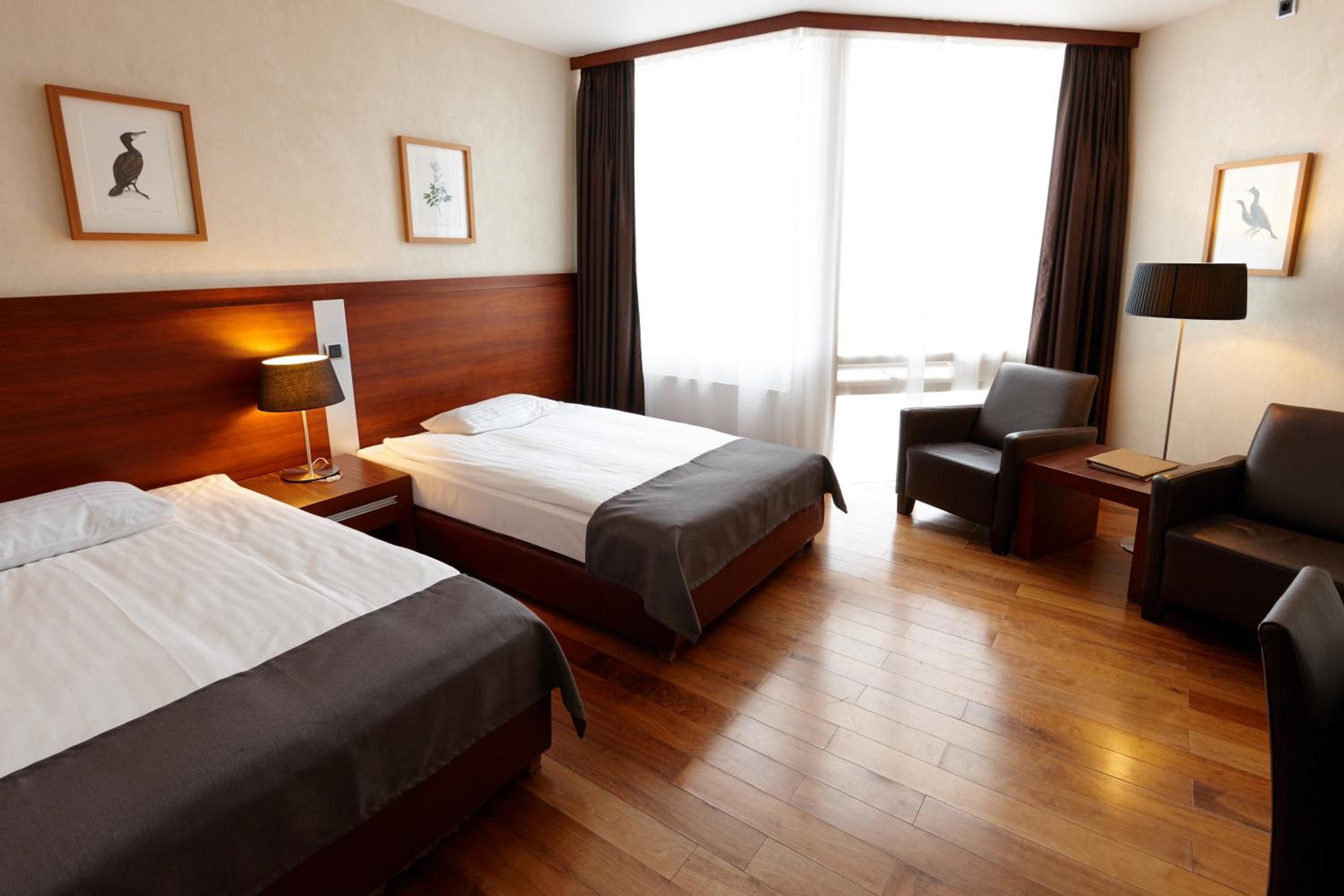 Relax and unwind in this cozy hotel room.