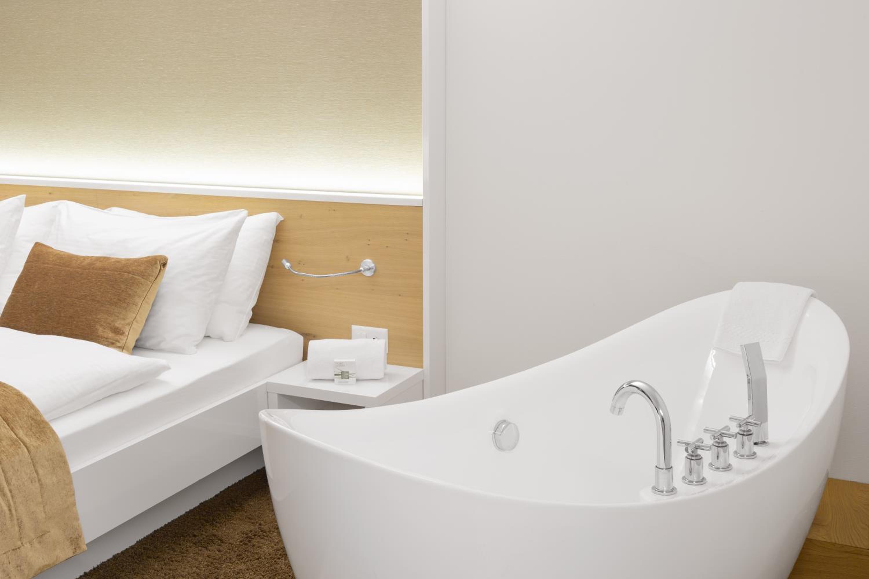 hotel room with a white bathtub in the foreground