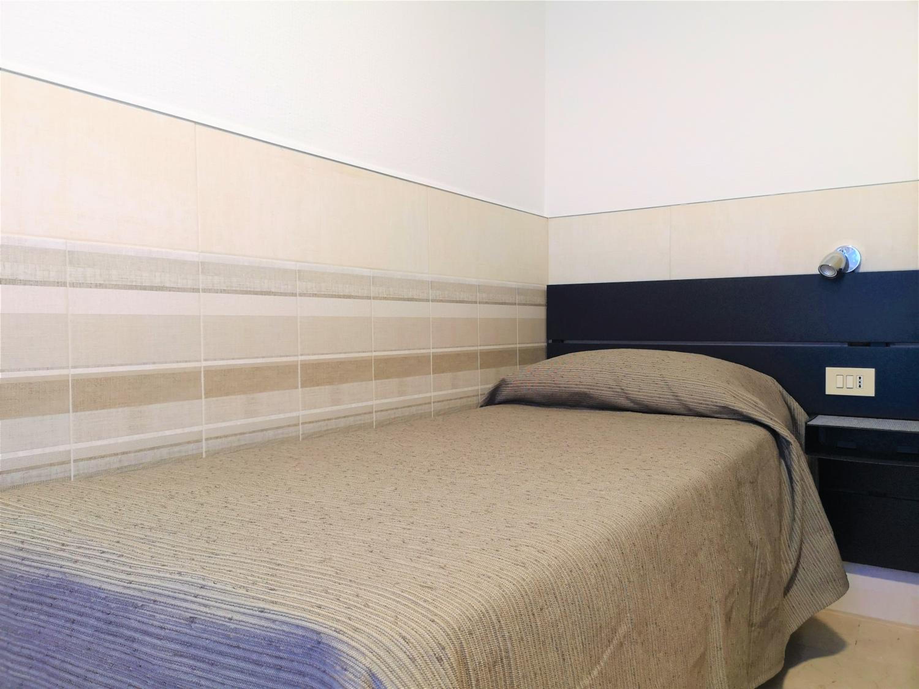 Camera Singola con bagno condiviso
